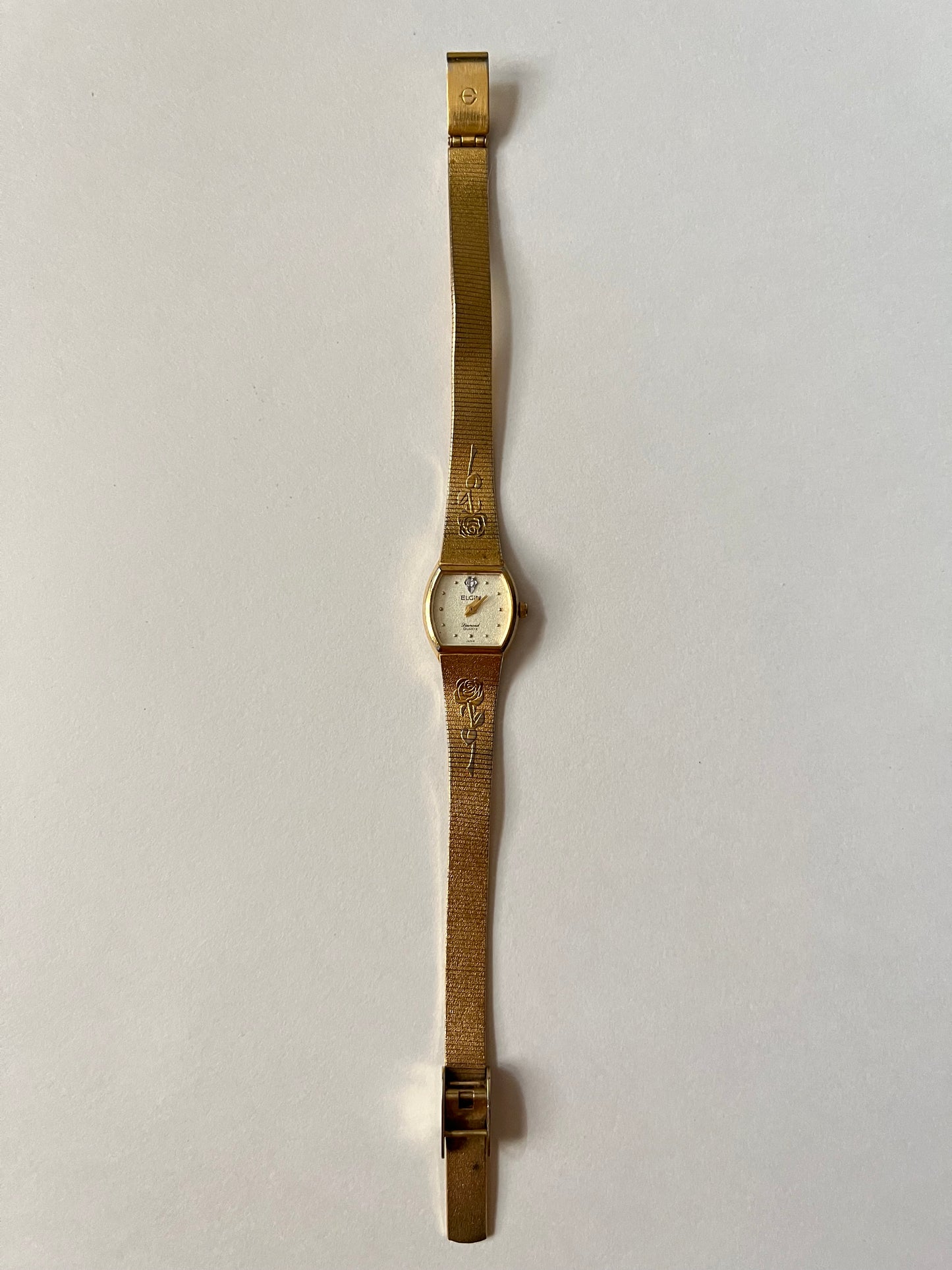 Elegant Vintage Gold Tone Watch with Rose Stem Accents
