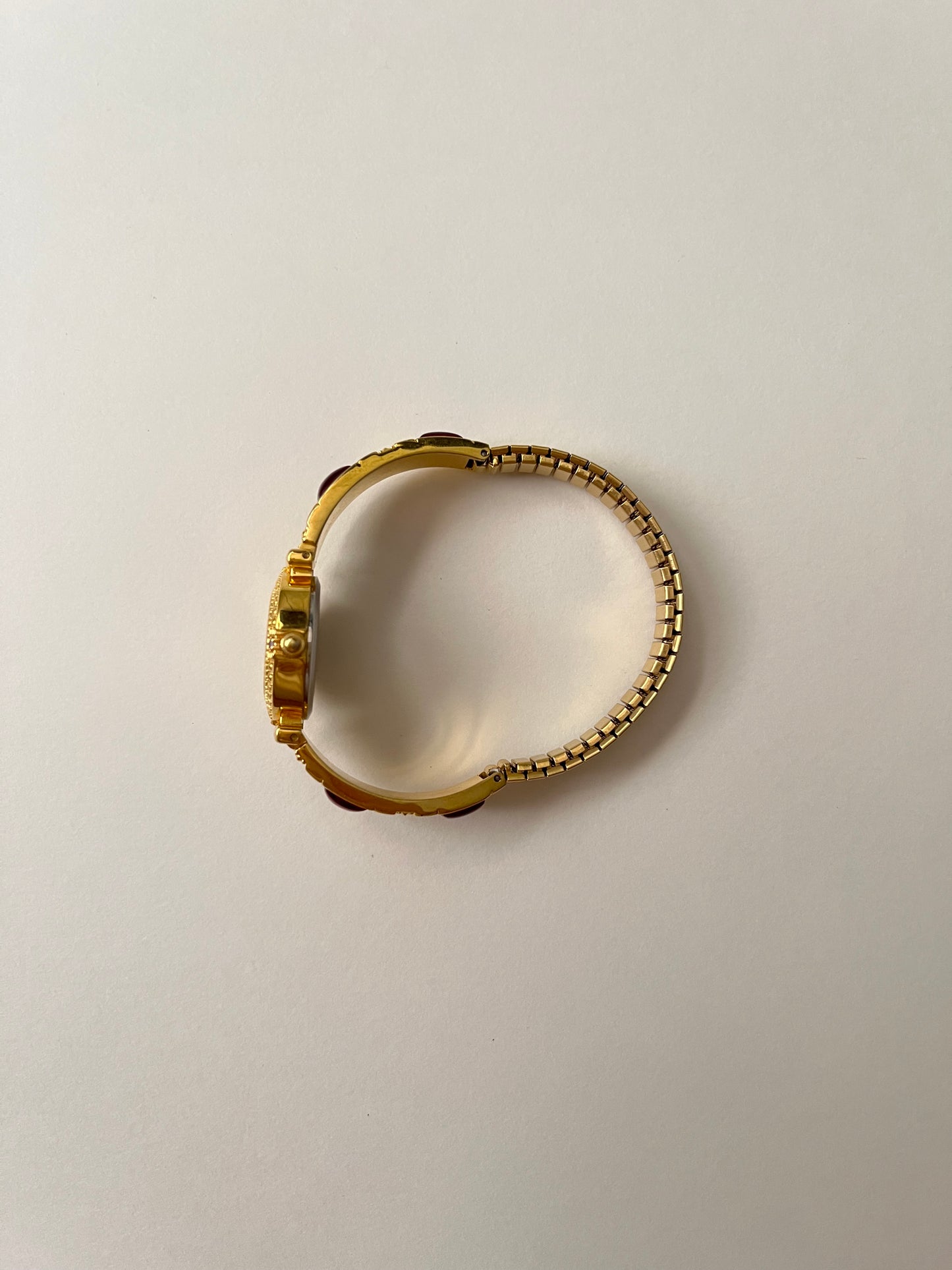 Gorgeous Gold Tone Expansion Watch with Red Gems Accent