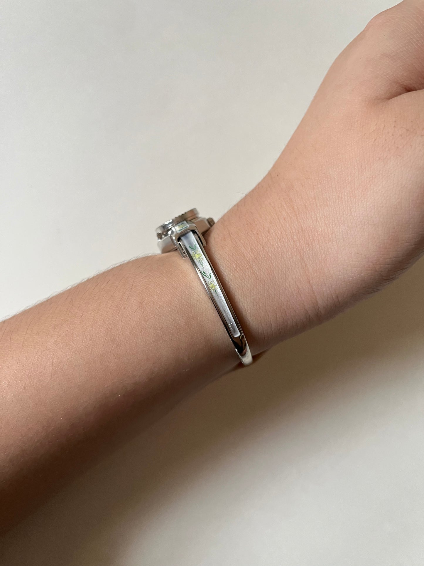 Beautiful Silver Tone Open Cuff Peekaboo Swiss Watch with White Floral Enameled Bracelet