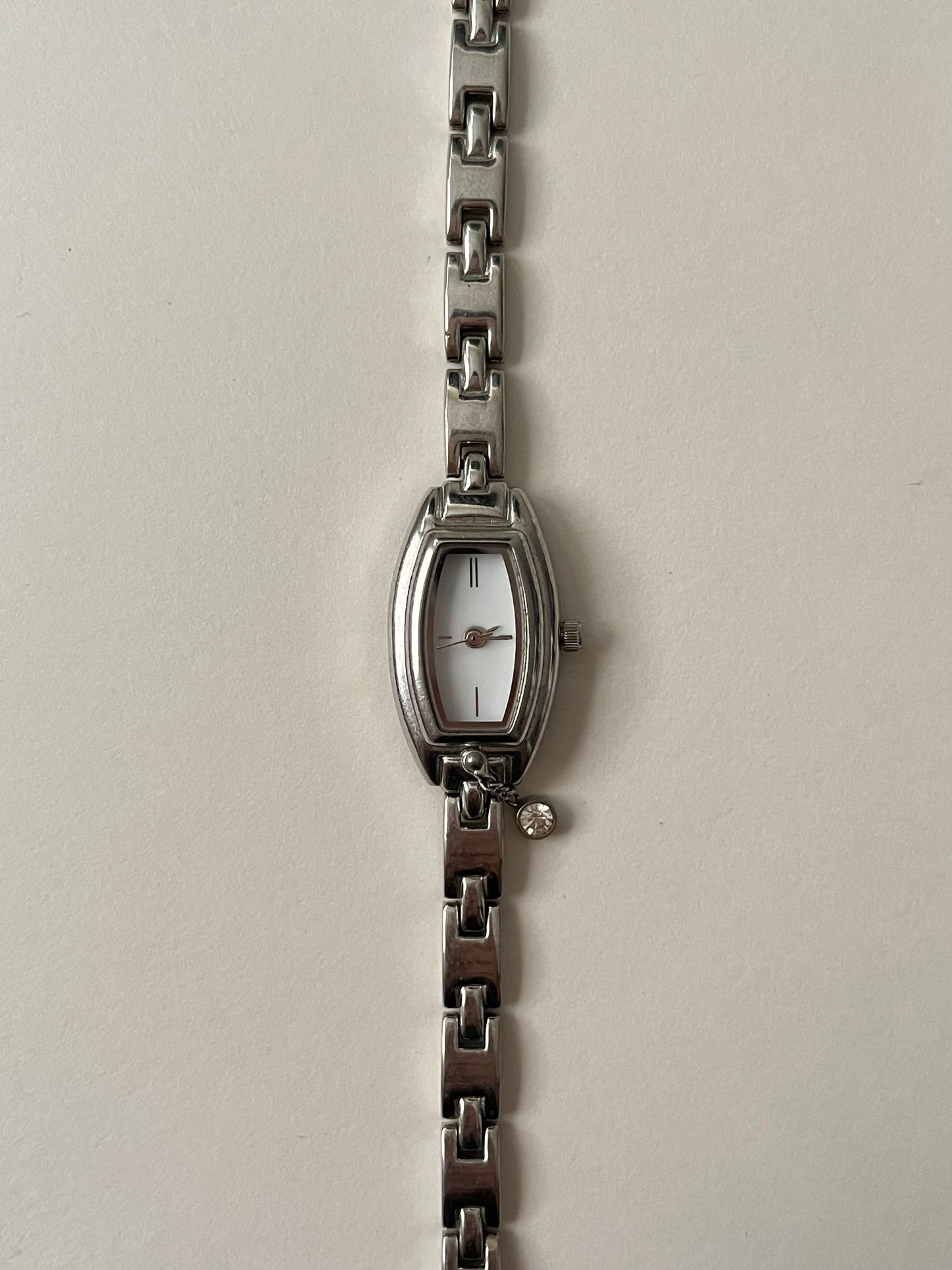 Dainty Silver Tone Watch with Tiny Charm and Rectangular Dial