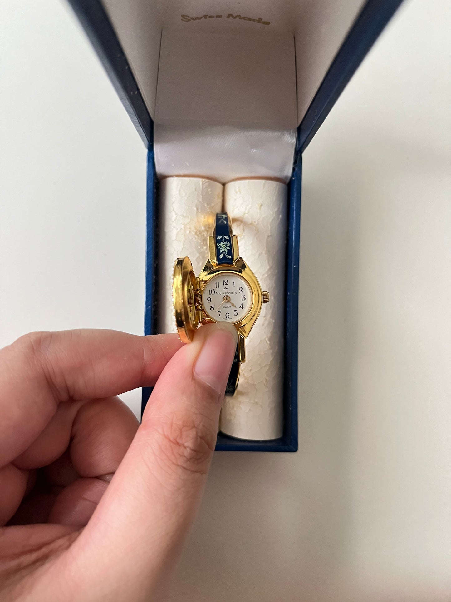 Beautiful Gold Tone Open Cuff Peekaboo Swiss Watch with Navy Floral Enameled Bracelet