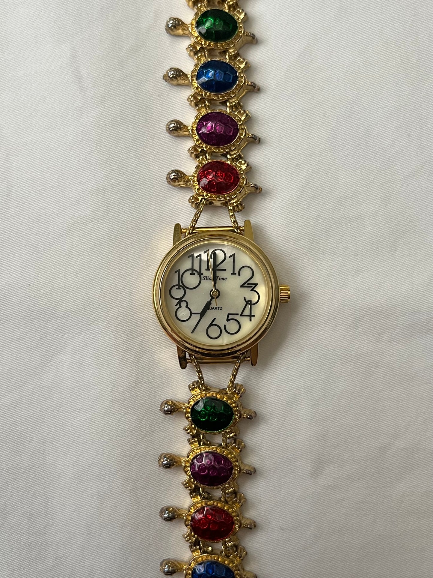 Adorable Gold Tone Slider Watch with Turtle Charms