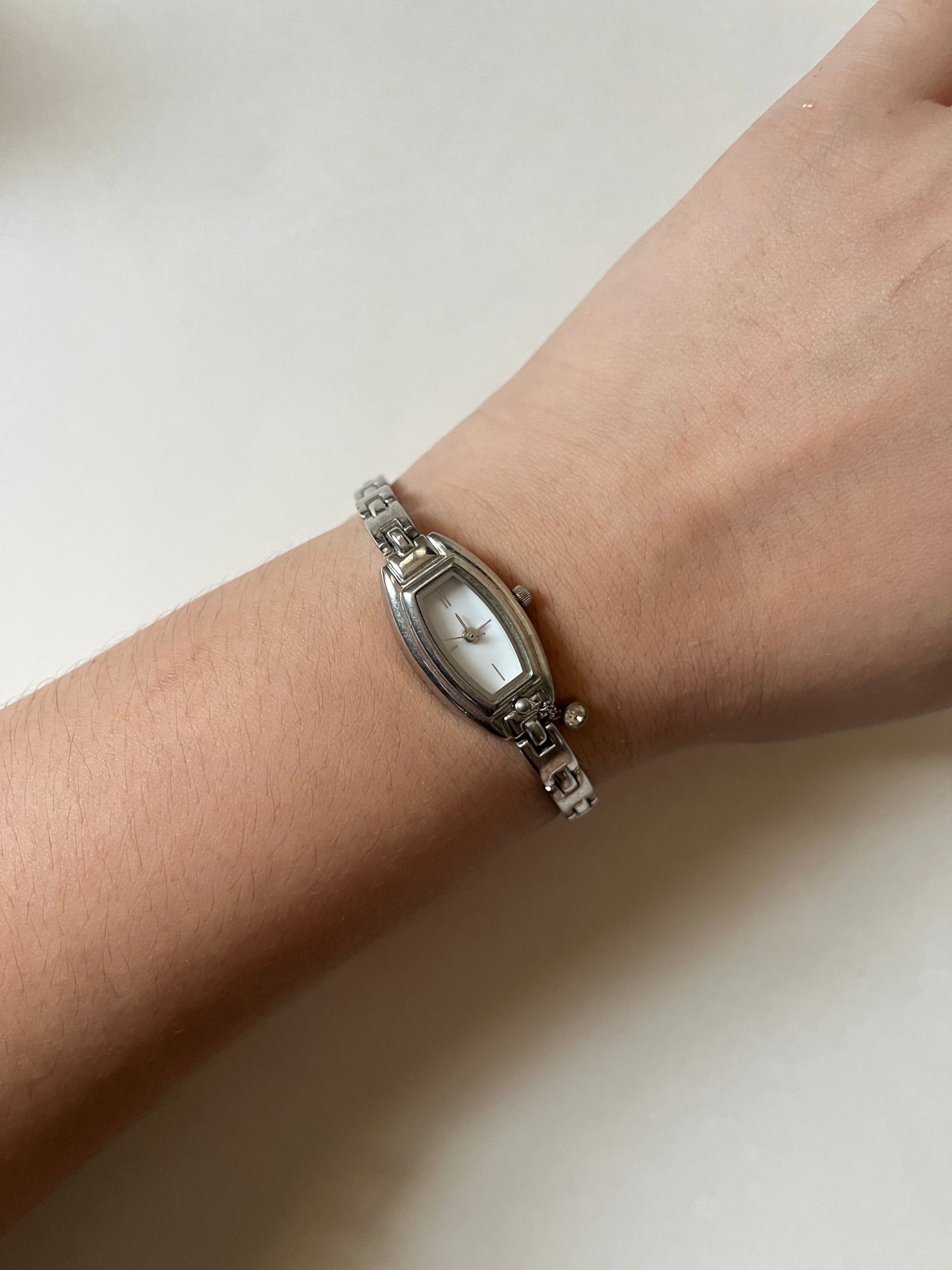 Dainty Silver Tone Watch with Tiny Charm and Rectangular Dial