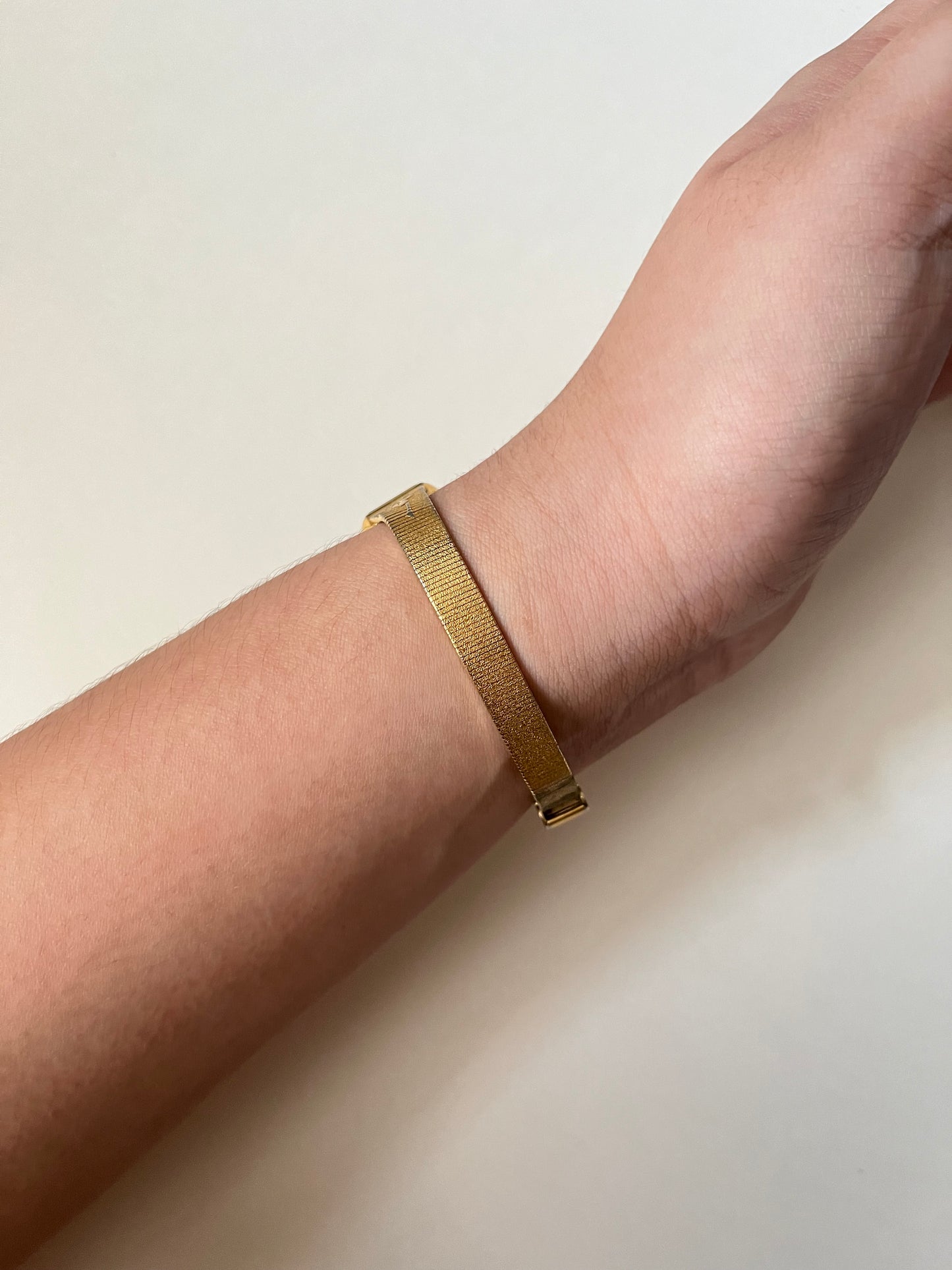 Elegant Vintage Gold Tone Watch with Rose Stem Accents