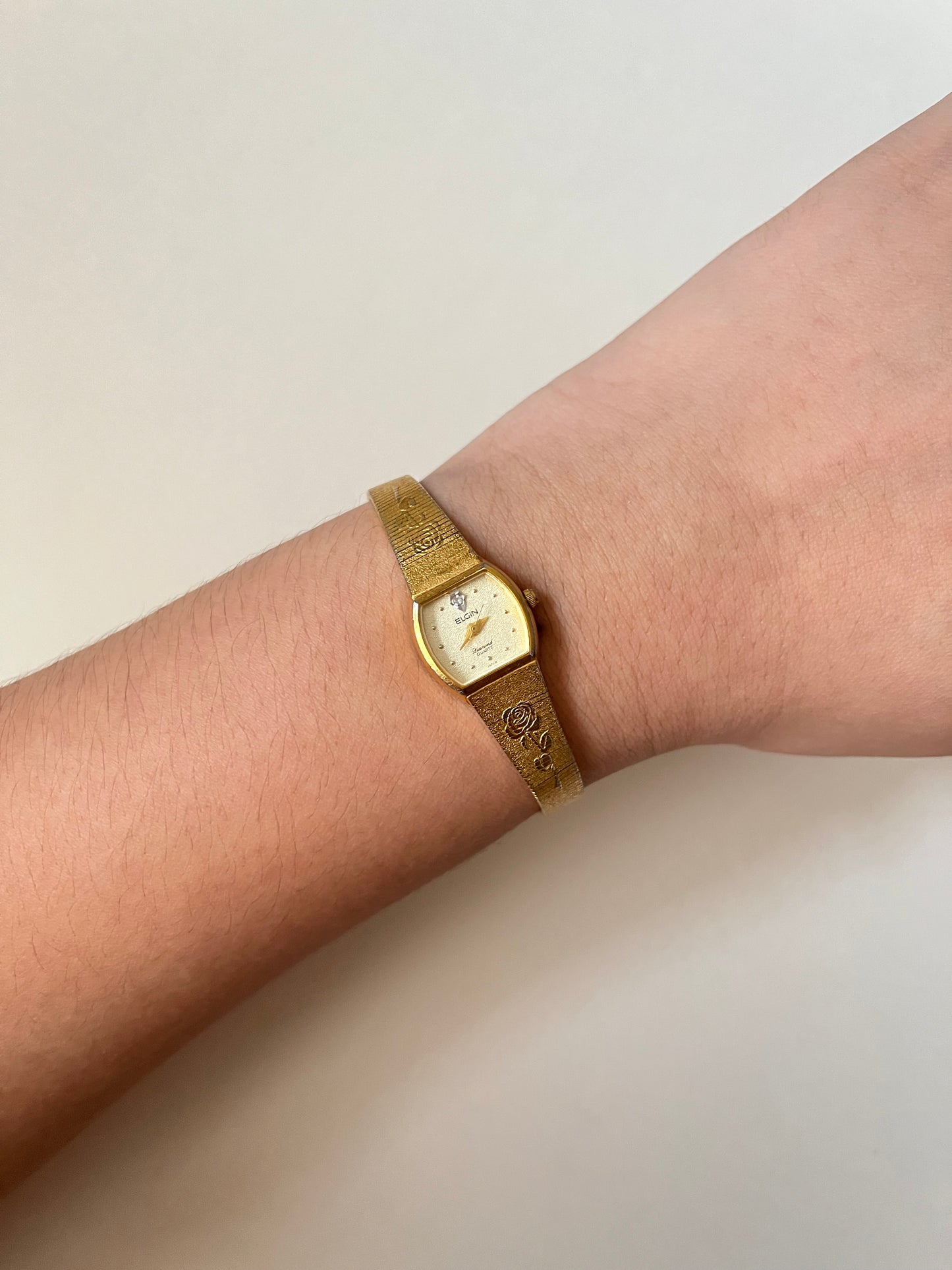 Elegant Vintage Gold Tone Watch with Rose Stem Accents