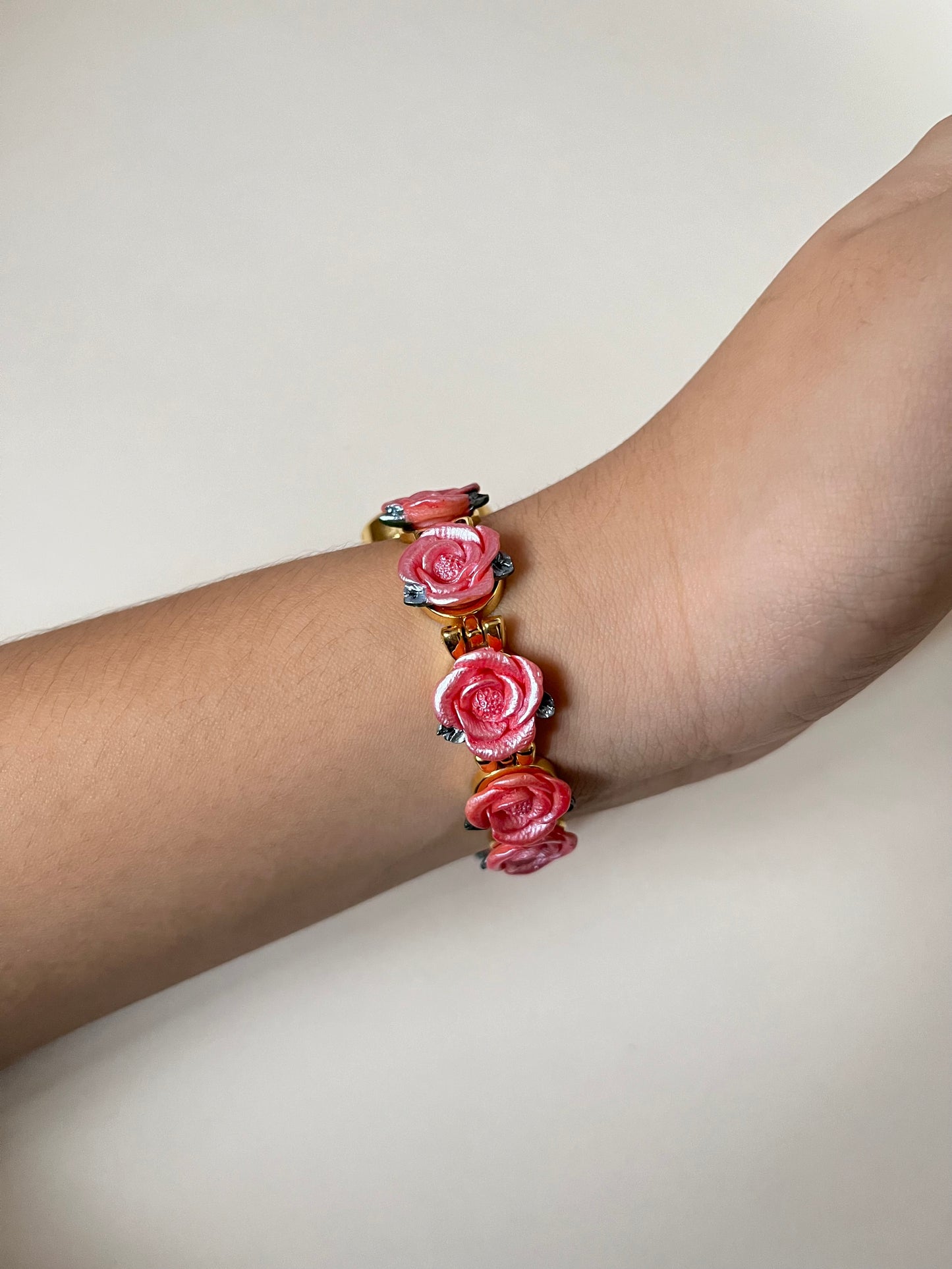 Pretty Gold Tone Watch with Round Dial and Pink Rose Links