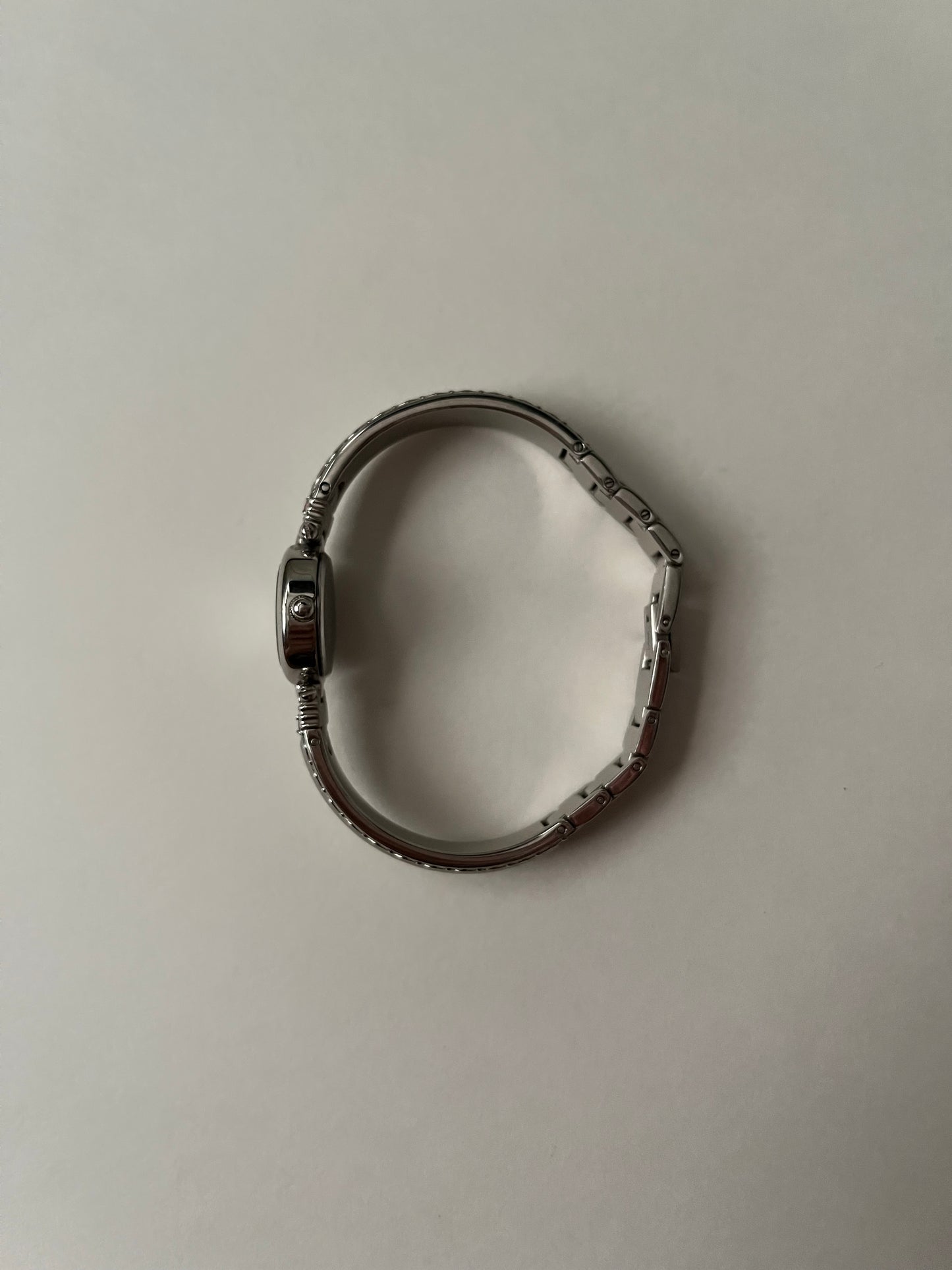 Silver Tone Anne Klein Cuff Watch with Oval Dial and Pink Stones Accent