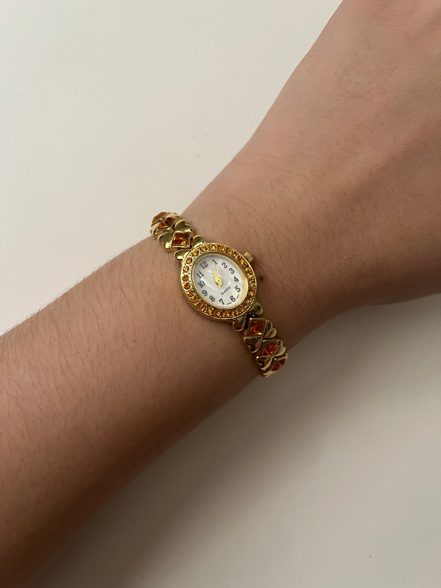 Beautiful Gold Tone Watch with Orange Stones Accents and Pin Accessories