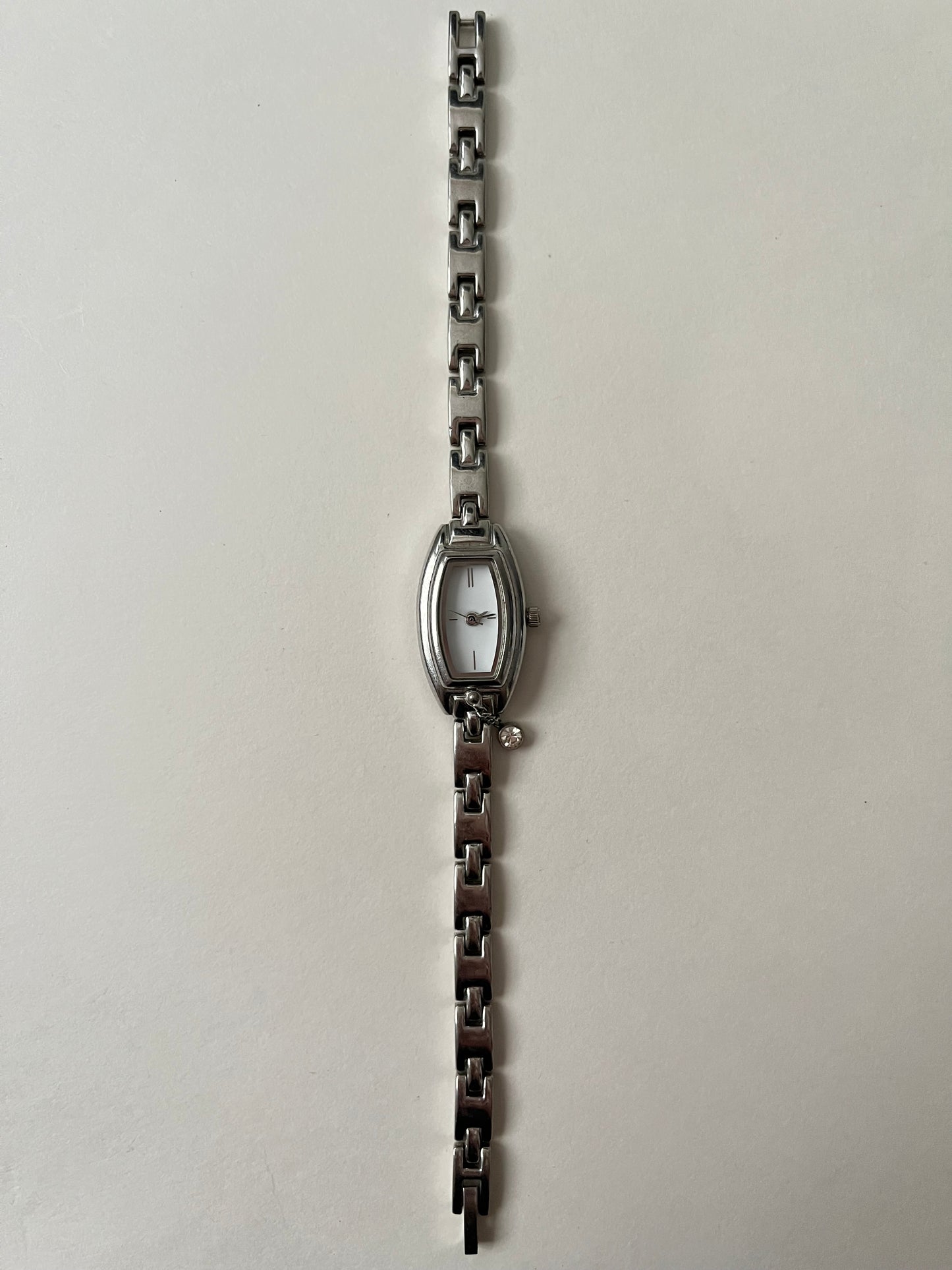 Dainty Silver Tone Watch with Tiny Charm and Rectangular Dial