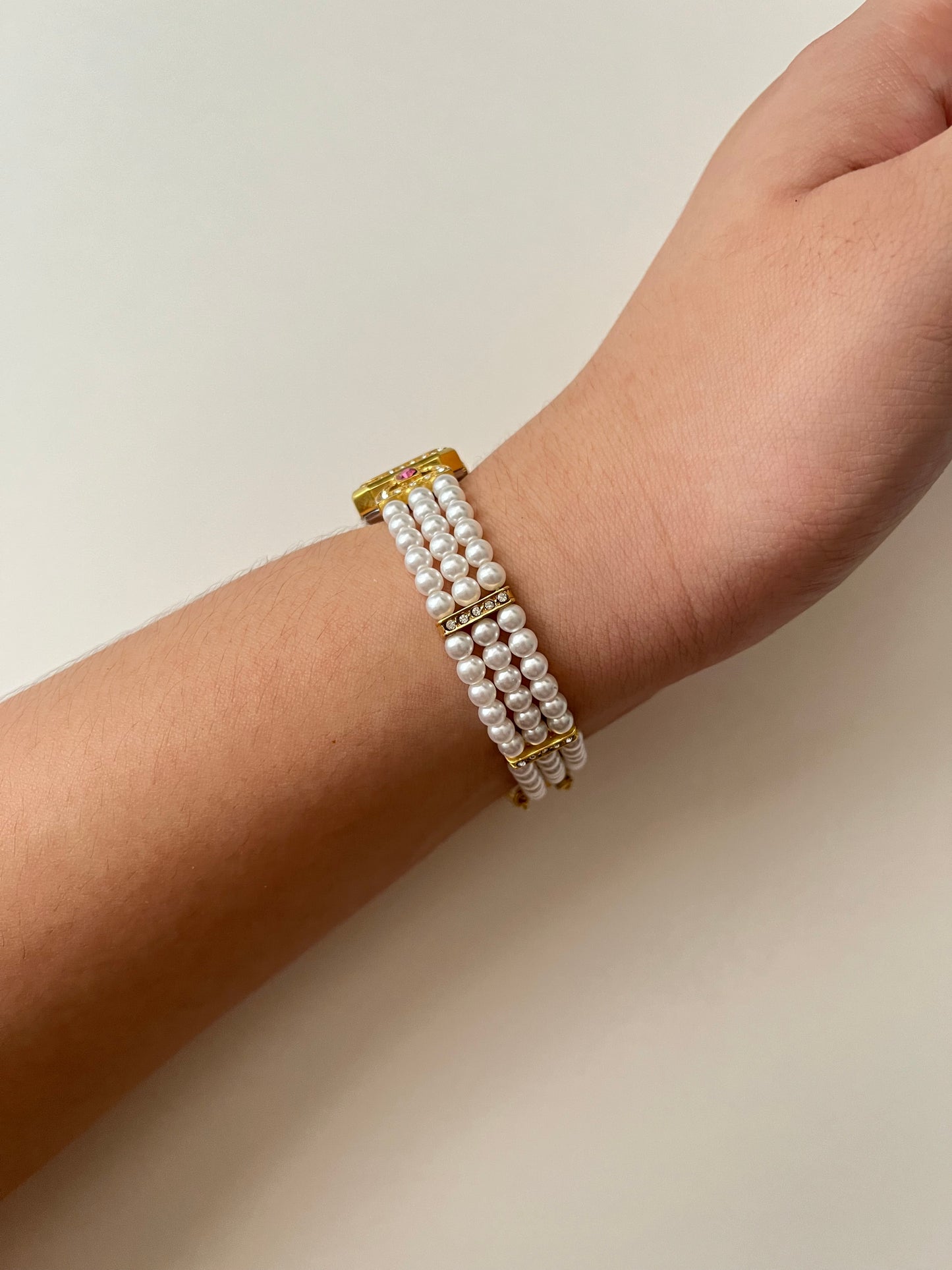 Gorgeous Faux Pearl Gold Tone Watch with Rectangular Dial and White and Pink Stones Accent