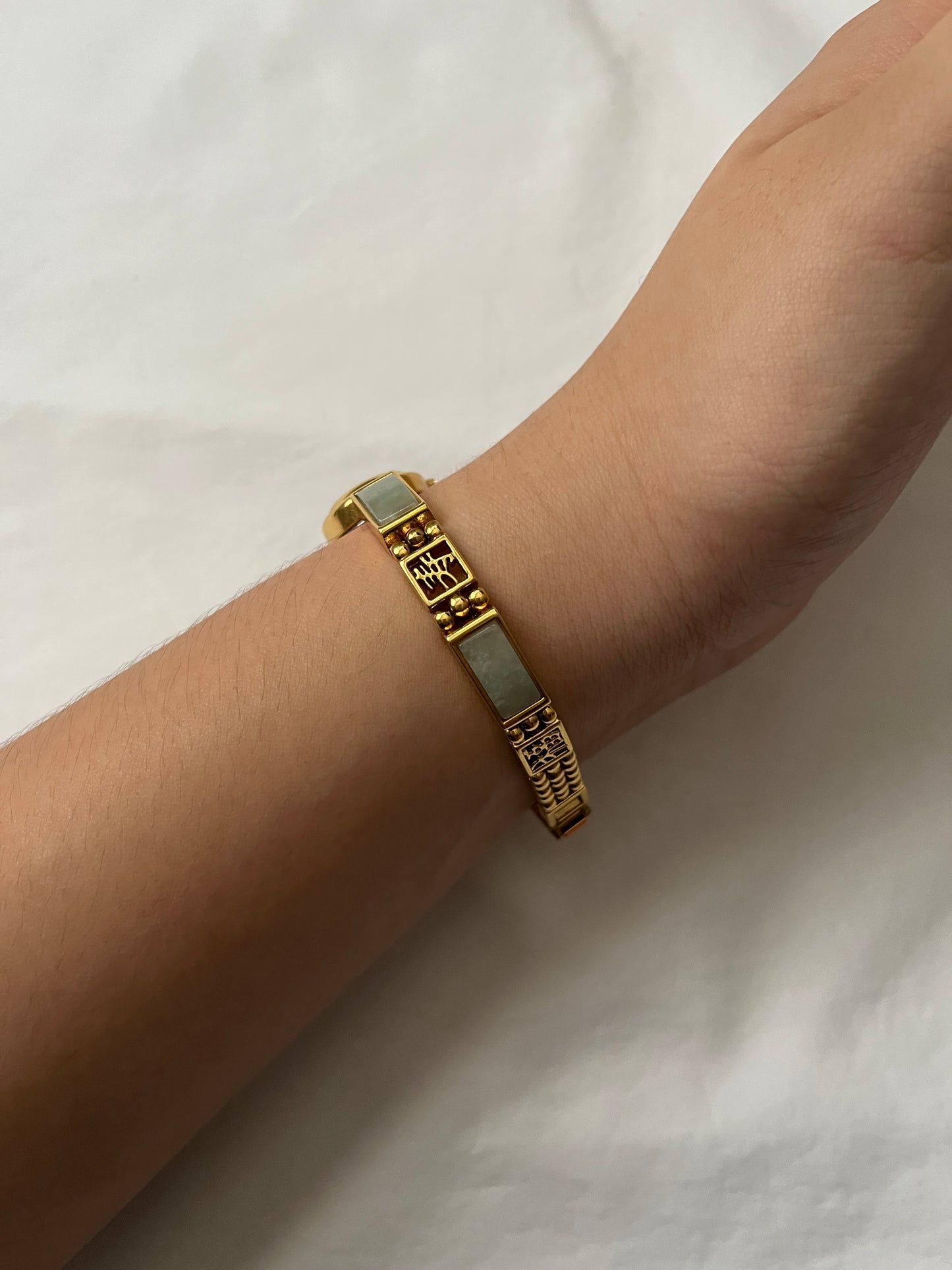 Stunning Gold Tone Watch with Oval Dial and Jade Inlay Band