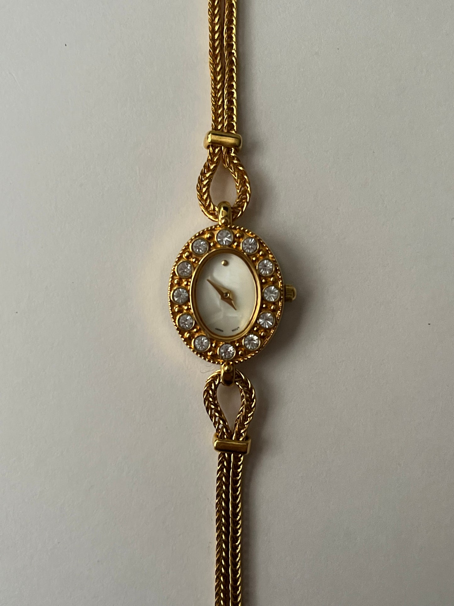 Elegant Dainty Gold Tone Tennis Bracelet Style Watch with Bejeweled Oval Dial