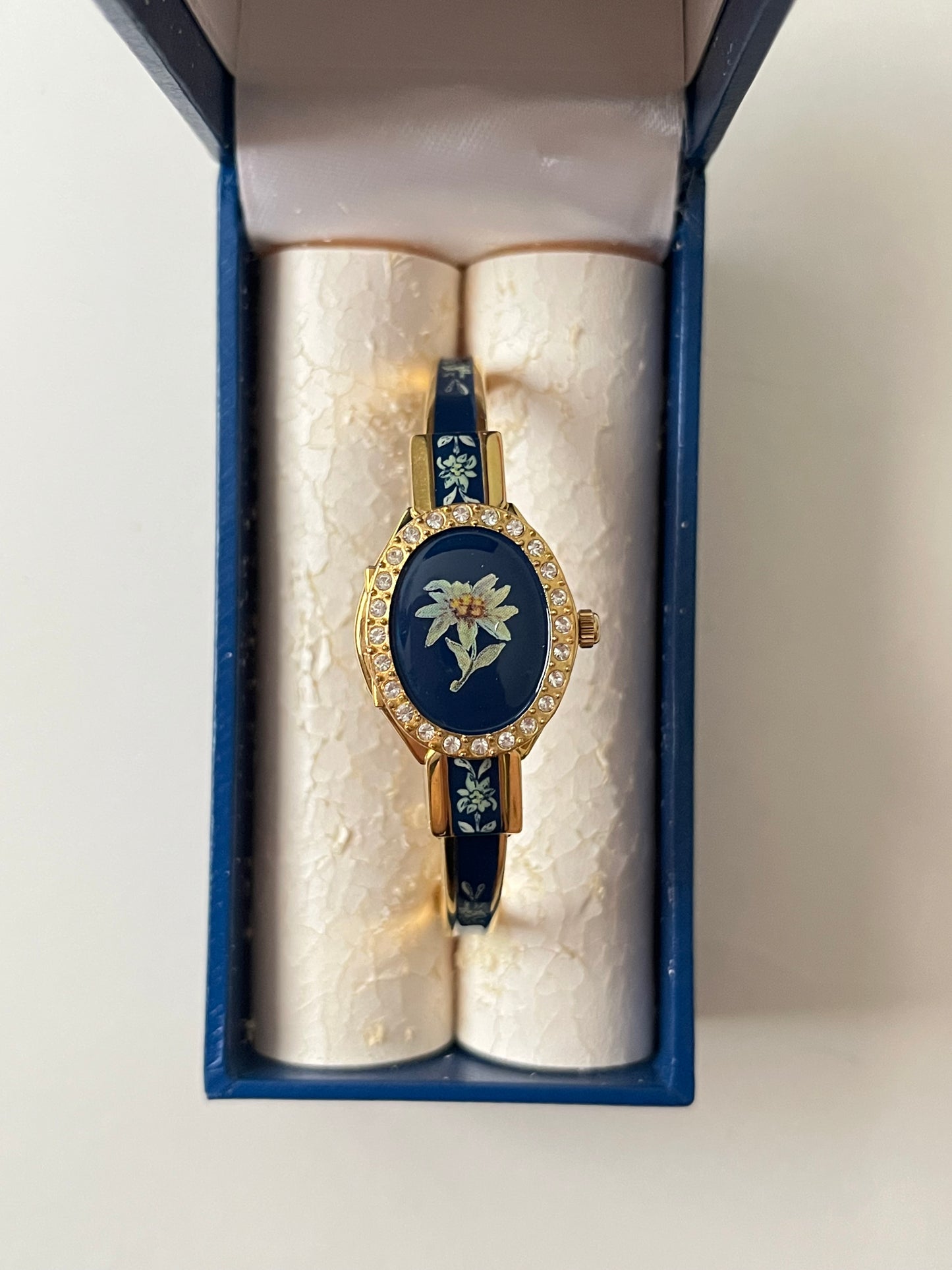 Beautiful Gold Tone Open Cuff Peekaboo Swiss Watch with Navy Floral Enameled Bracelet