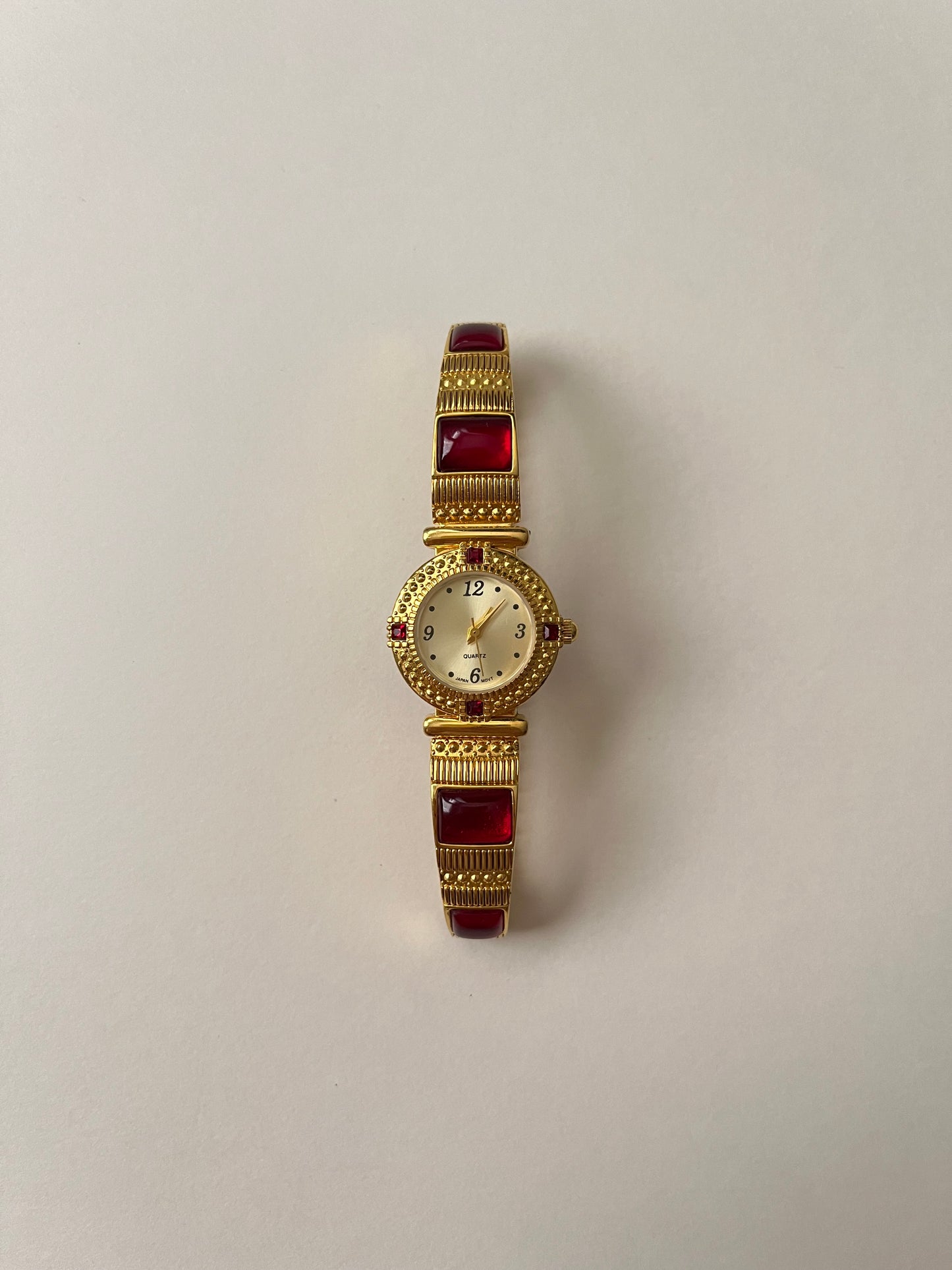 Gorgeous Gold Tone Expansion Watch with Red Gems Accent