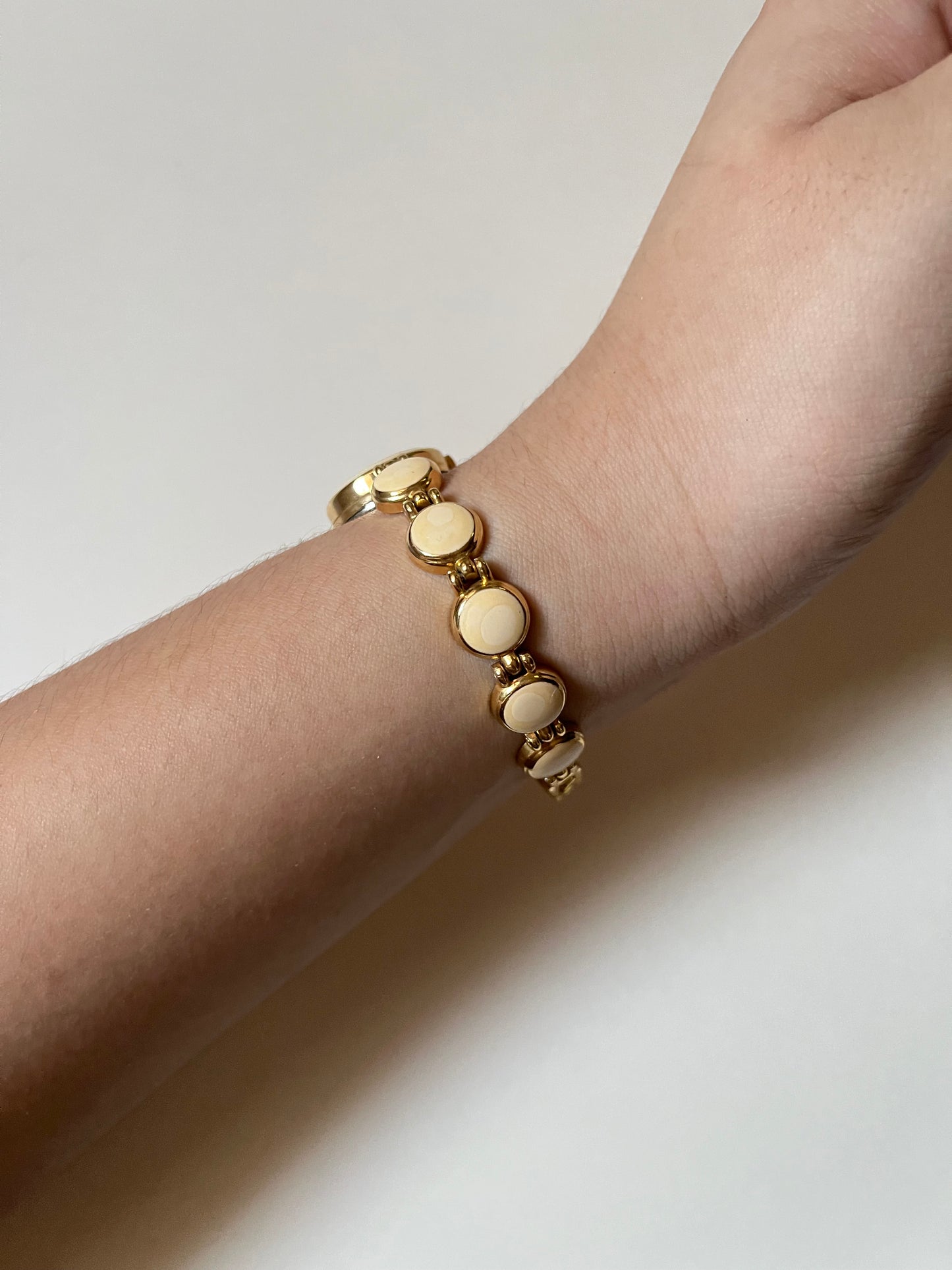 Adorable Gold Tone Watch with Round Dial and White Enameled Band Design