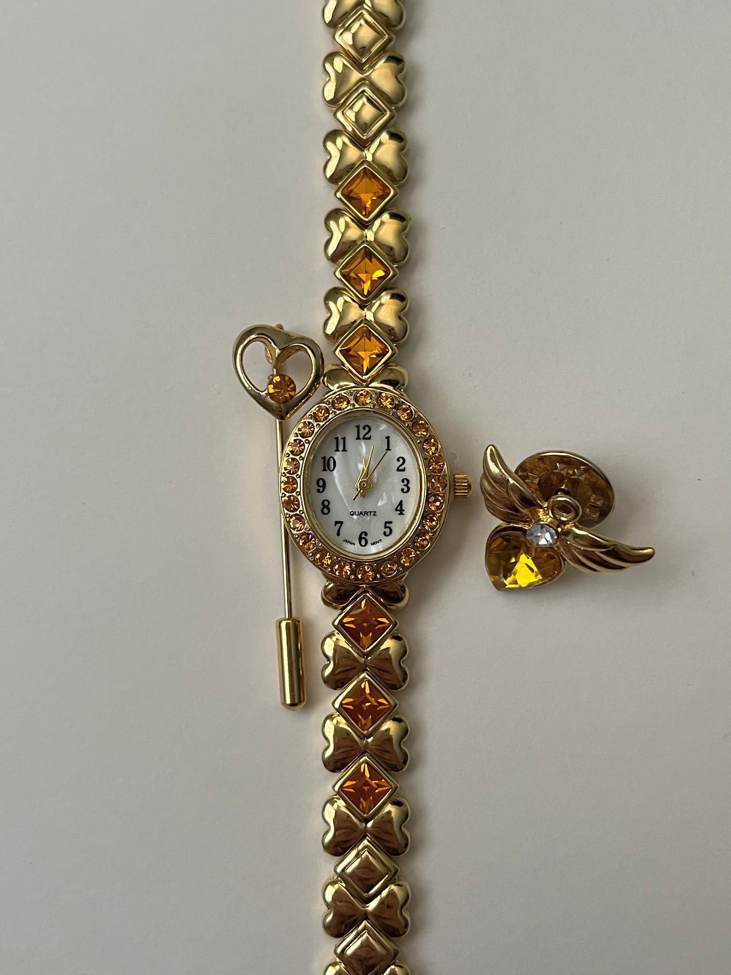Beautiful Gold Tone Watch with Orange Stones Accents and Pin Accessories