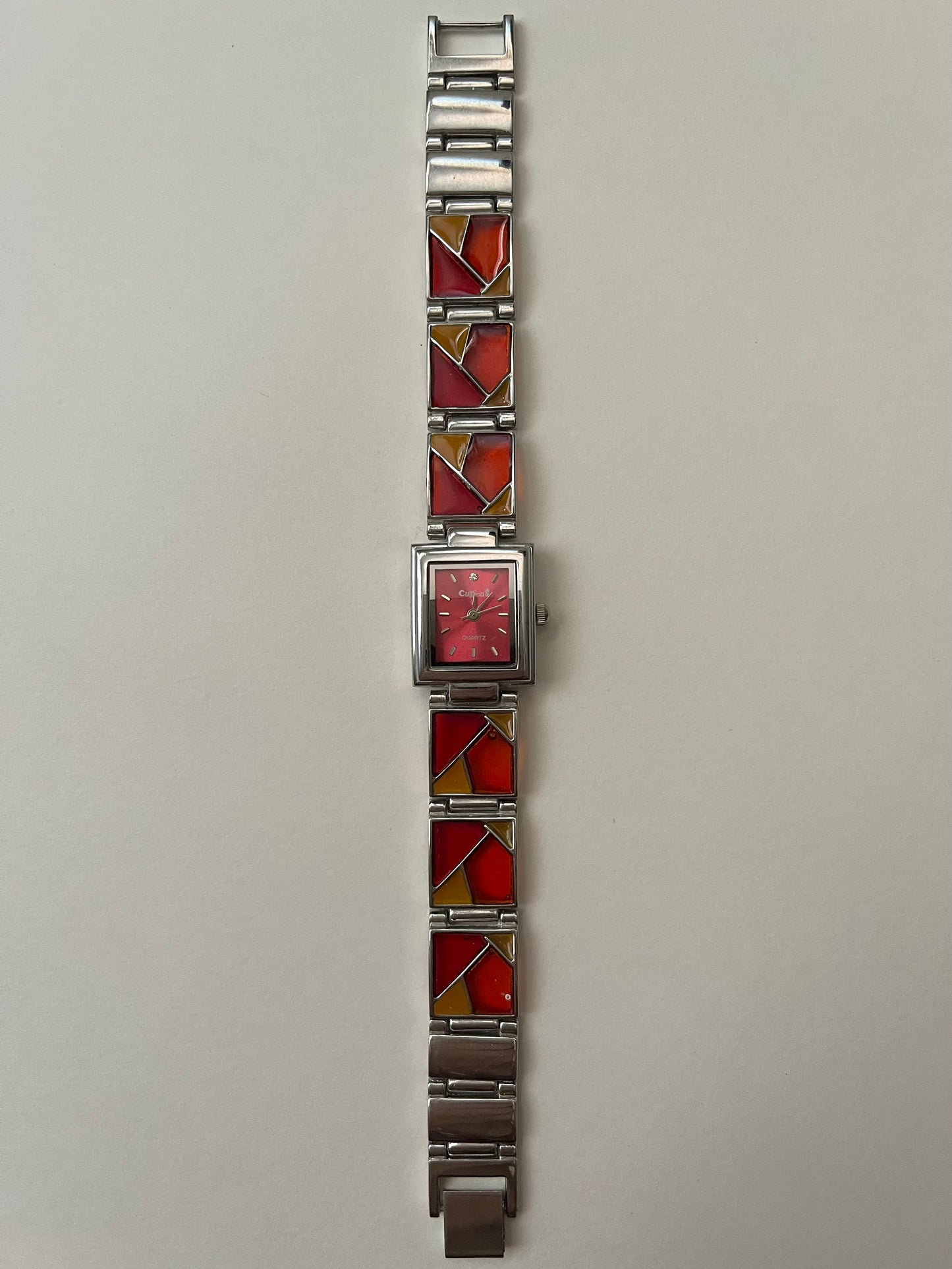Silver Tone Watch with Red Dial and Mosaic Tiles Band Design