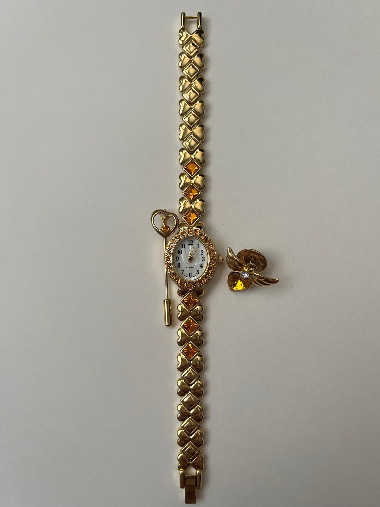 Beautiful Gold Tone Watch with Orange Stones Accents and Pin Accessories