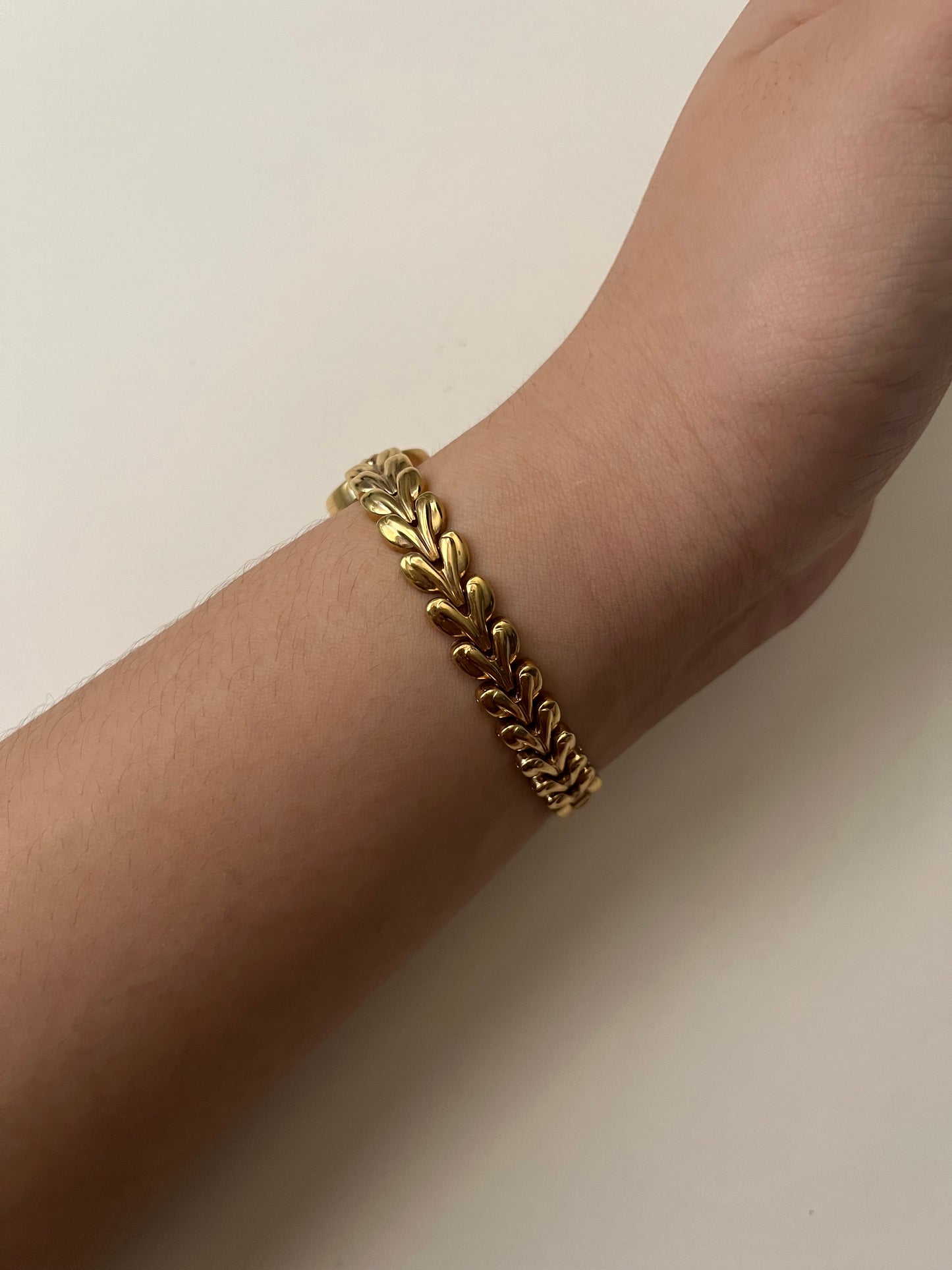 Gold Tone Watch with Black Round Dial