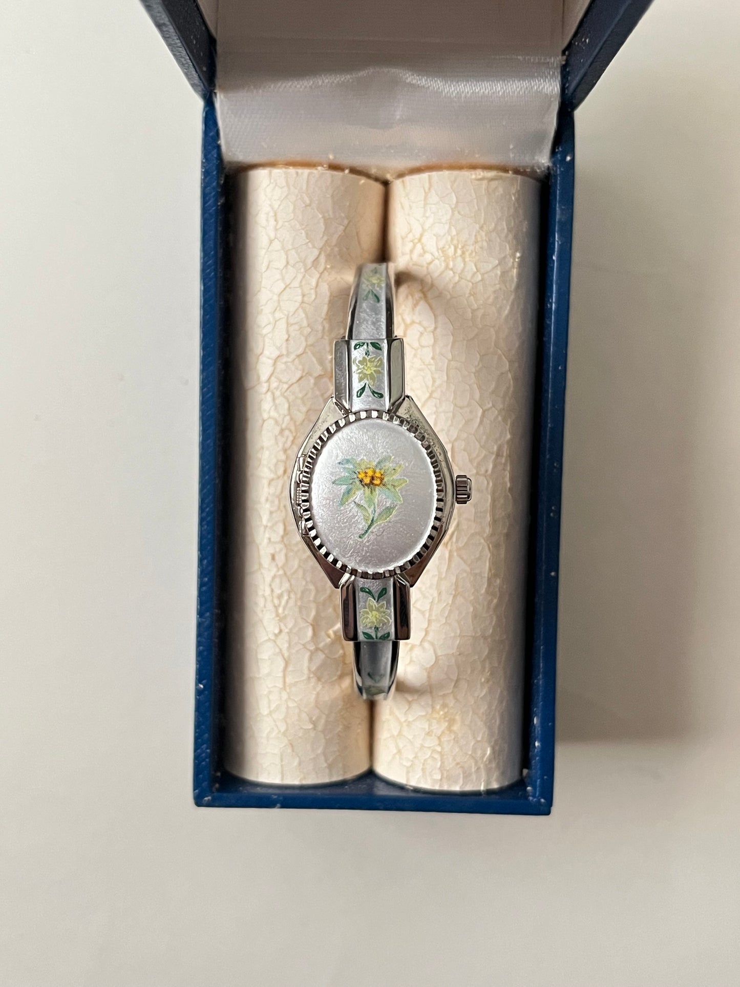 Beautiful Silver Tone Open Cuff Peekaboo Swiss Watch with White Floral Enameled Bracelet
