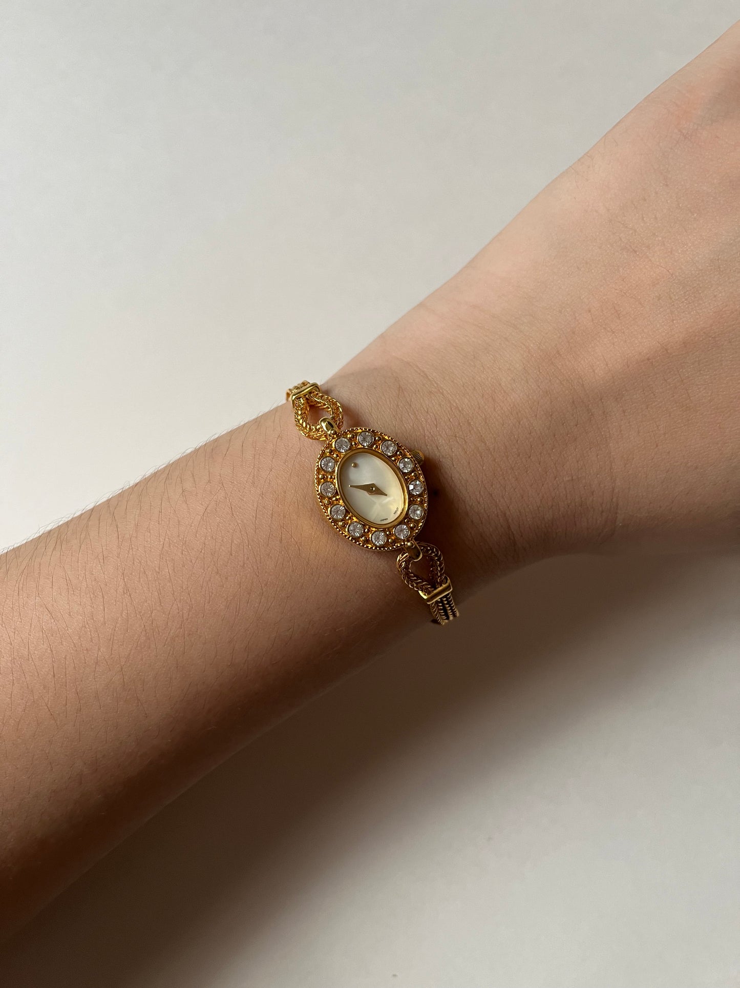 Elegant Dainty Gold Tone Tennis Bracelet Style Watch with Bejeweled Oval Dial