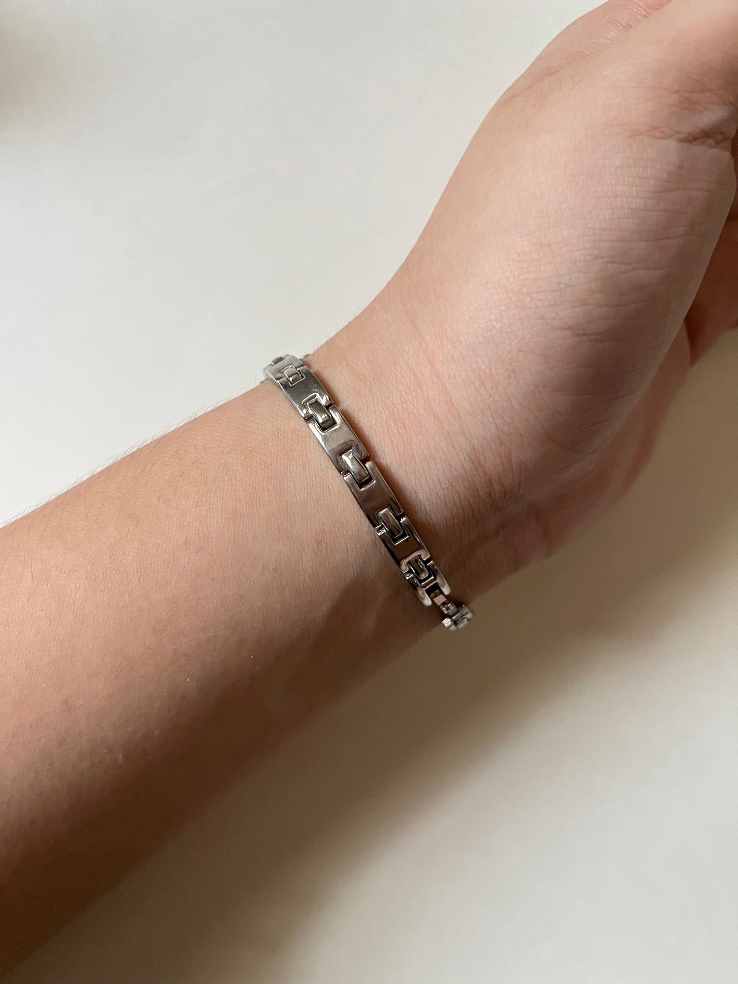 Dainty Silver Tone Watch with Tiny Charm and Rectangular Dial
