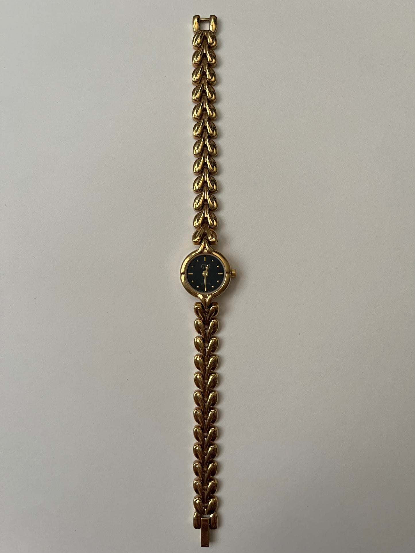 Gold Tone Watch with Black Round Dial