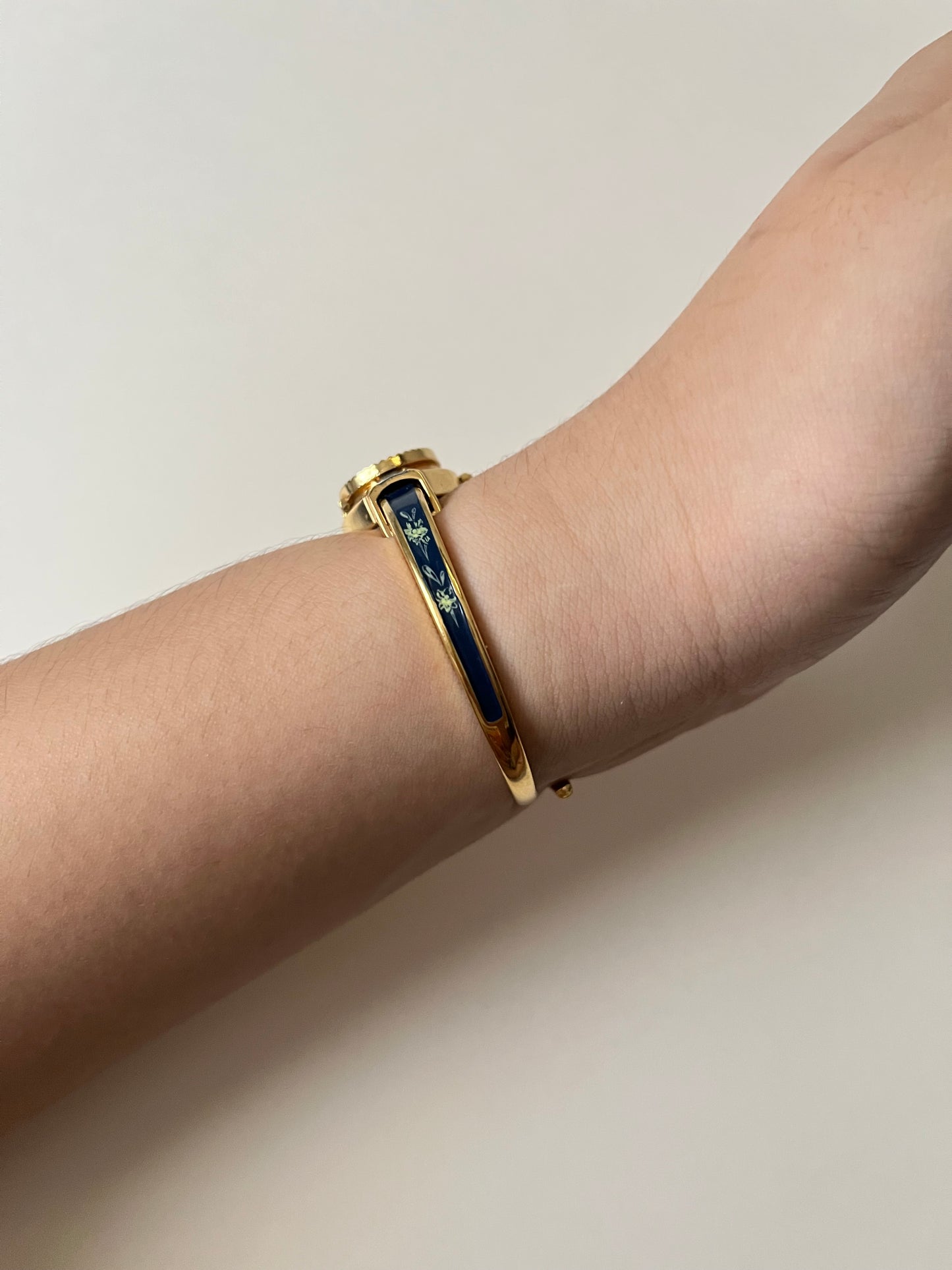 Beautiful Gold Tone Open Cuff Peekaboo Swiss Watch with Navy Blue Floral Enameled Bracelet