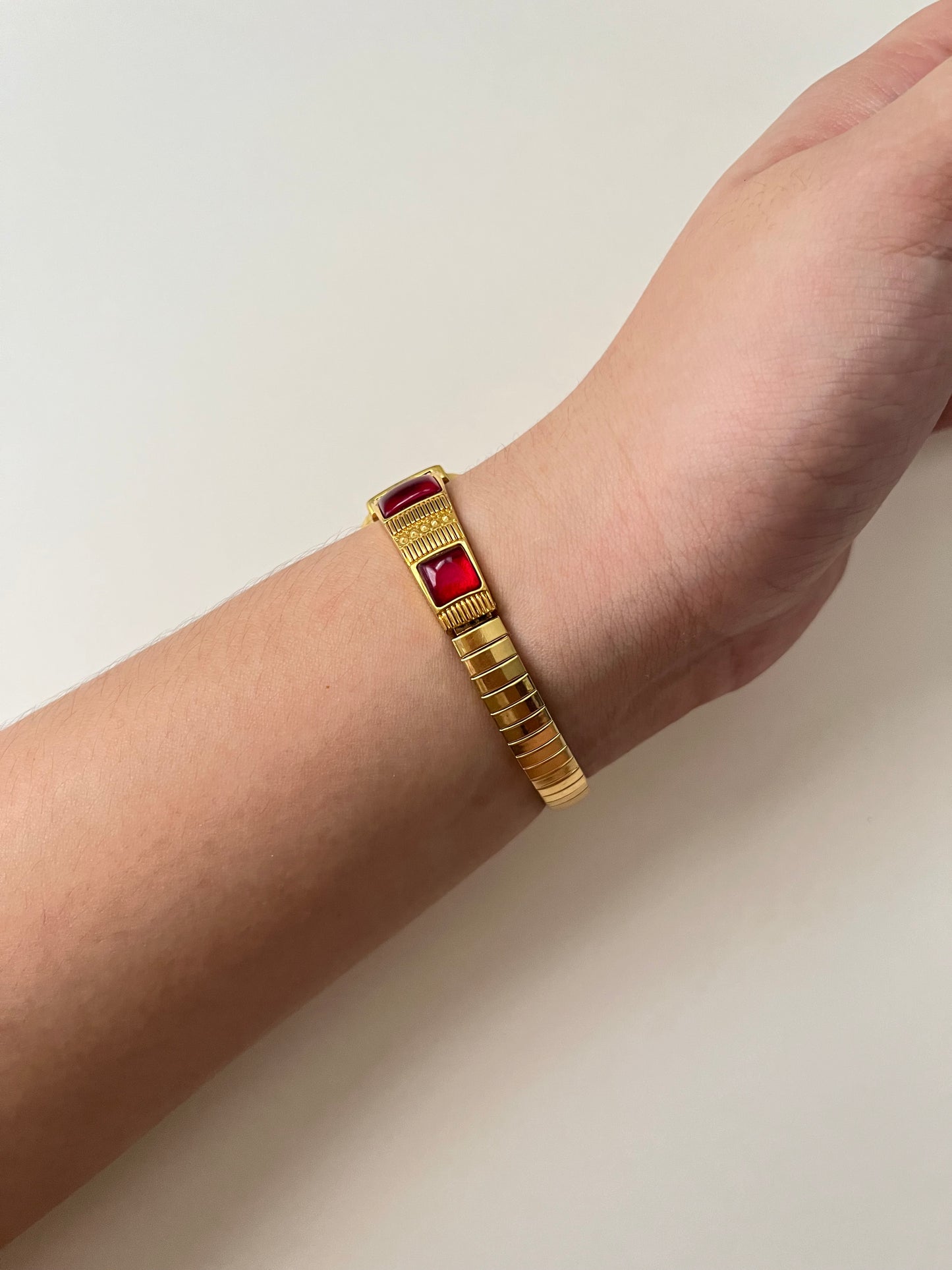 Gorgeous Gold Tone Expansion Watch with Red Gems Accent