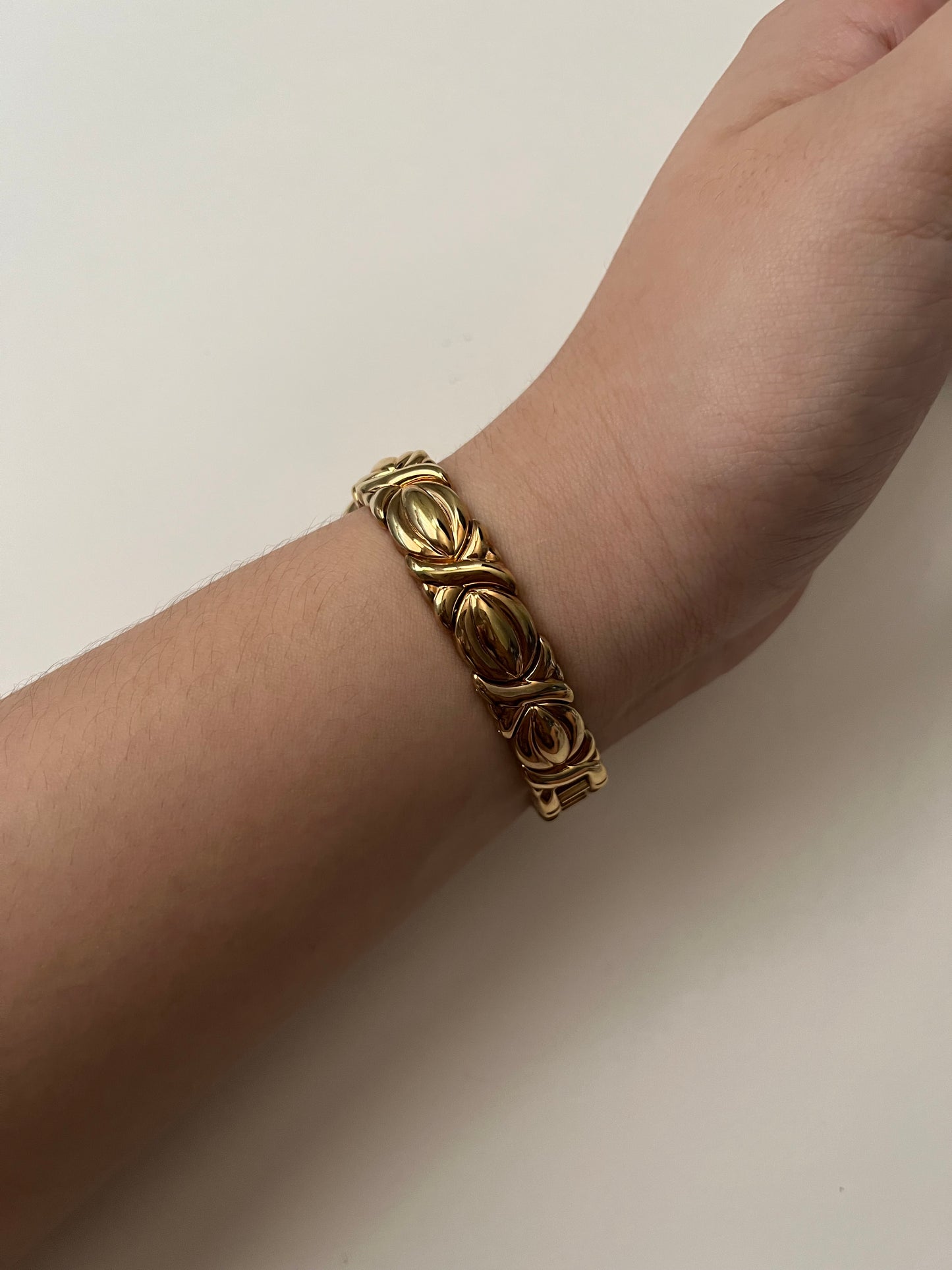 A Classic and Ornate Gold Tone Watch with Round Dial