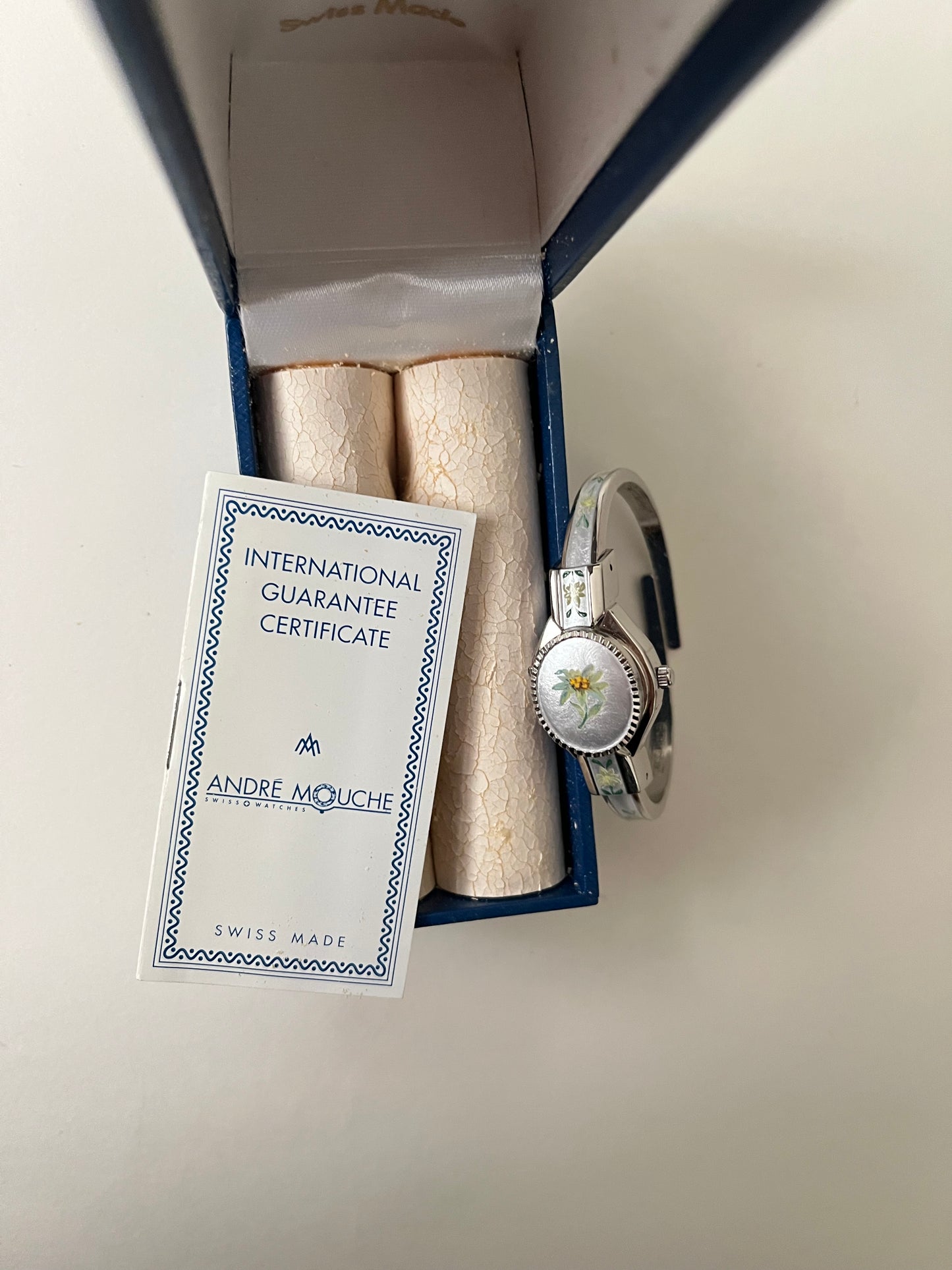 Beautiful Silver Tone Open Cuff Peekaboo Swiss Watch with White Floral Enameled Bracelet