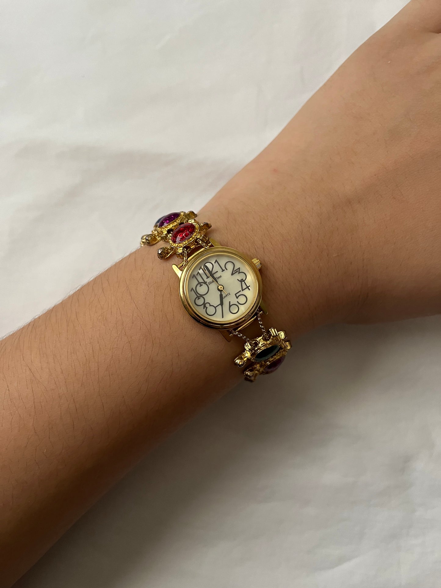 Adorable Gold Tone Slider Watch with Turtle Charms