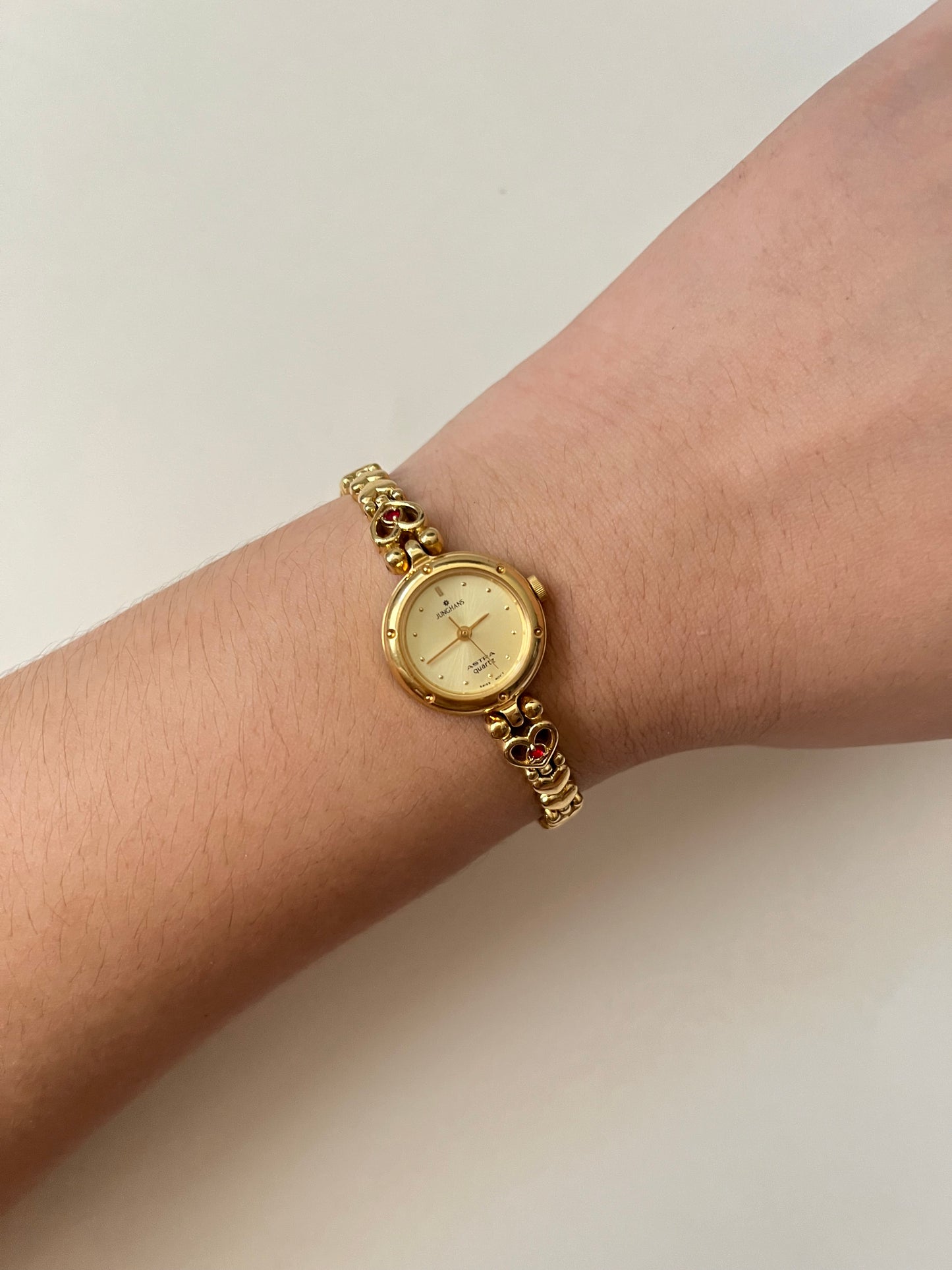 Adorable Dainty Gold Tone Swiss Watch with Heart-Shaped Links And Red Stones Accents