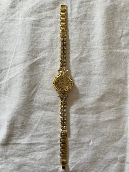 Elegant Gold Tone Watch with Crystals Encrusted Band