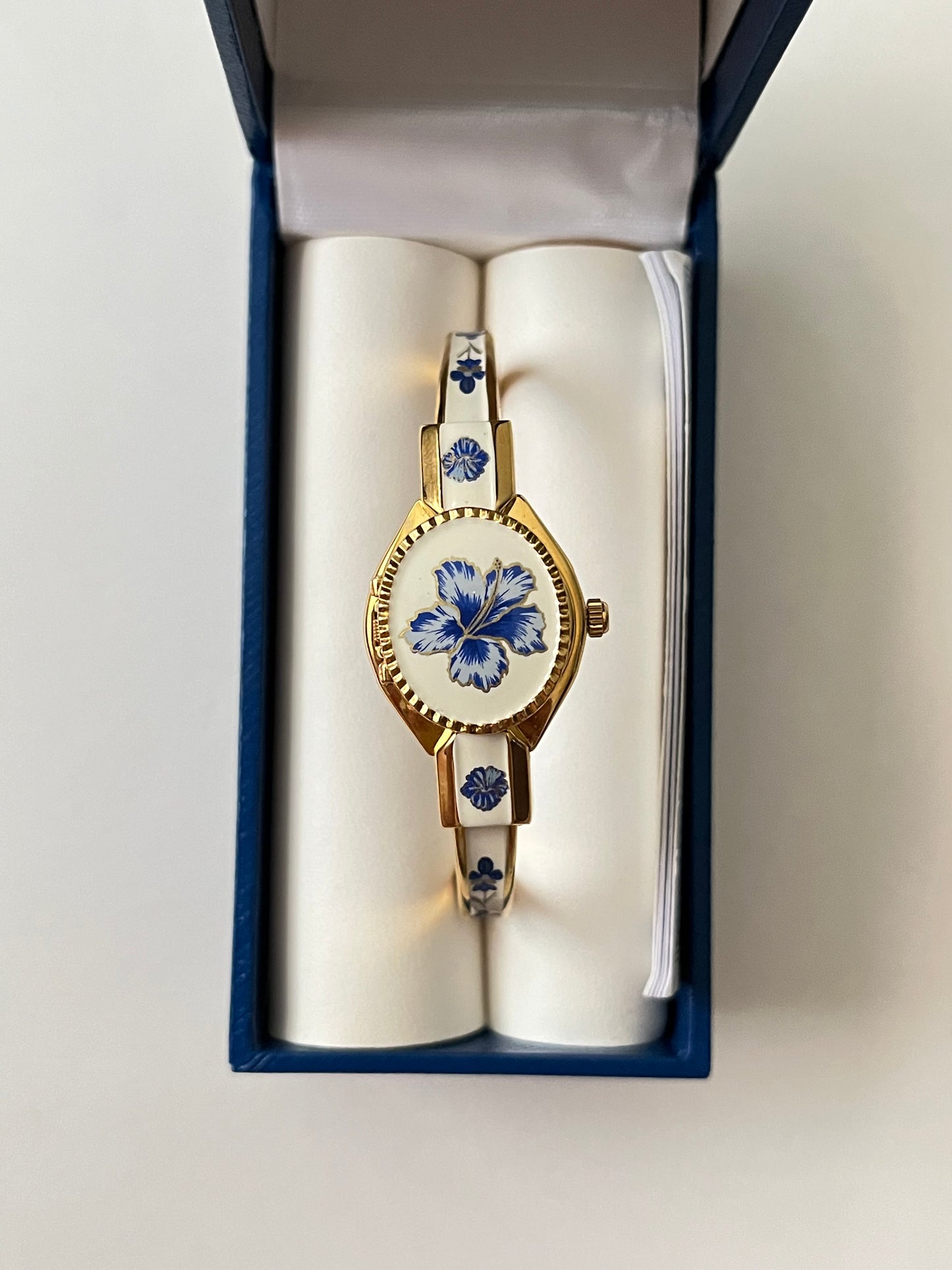 Beautiful Gold Tone Open Cuff Peekaboo Swiss Watch with Navy Floral Enameled Bracelet