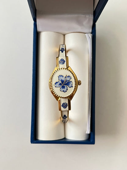 Beautiful Gold Tone Open Cuff Peekaboo Swiss Watch with Navy Floral Enameled Bracelet