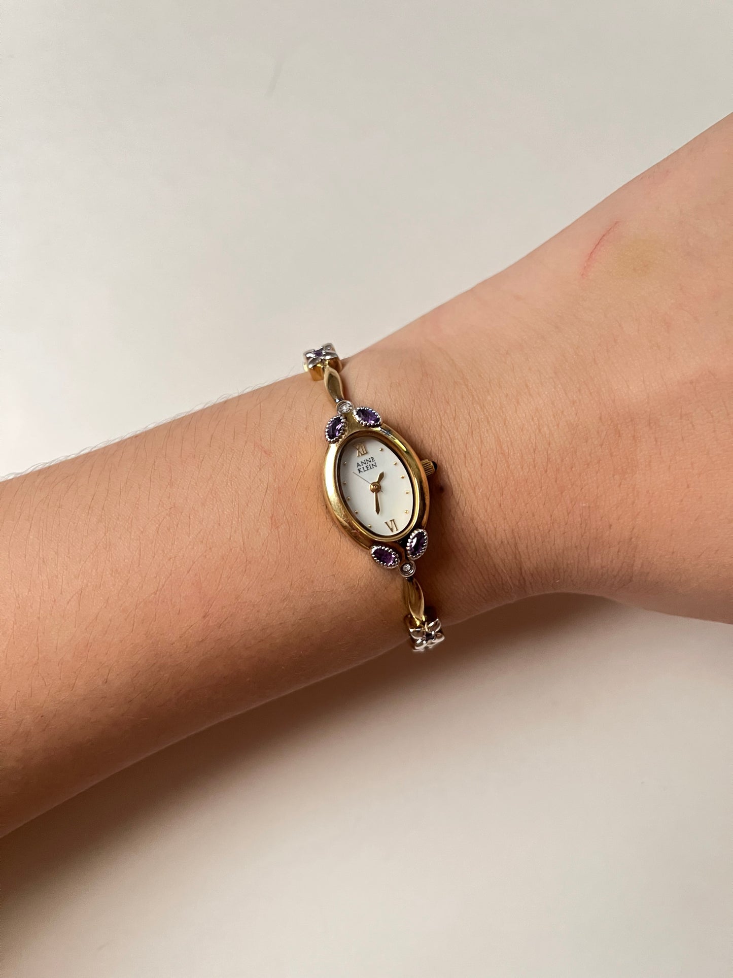 Gorgeous And Dainty Rare Gold Tone Anne Klein Watch with Purple Stones Accent