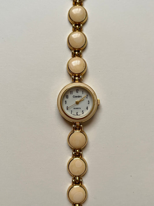 Adorable Gold Tone Watch with Round Dial and White Enameled Band Design
