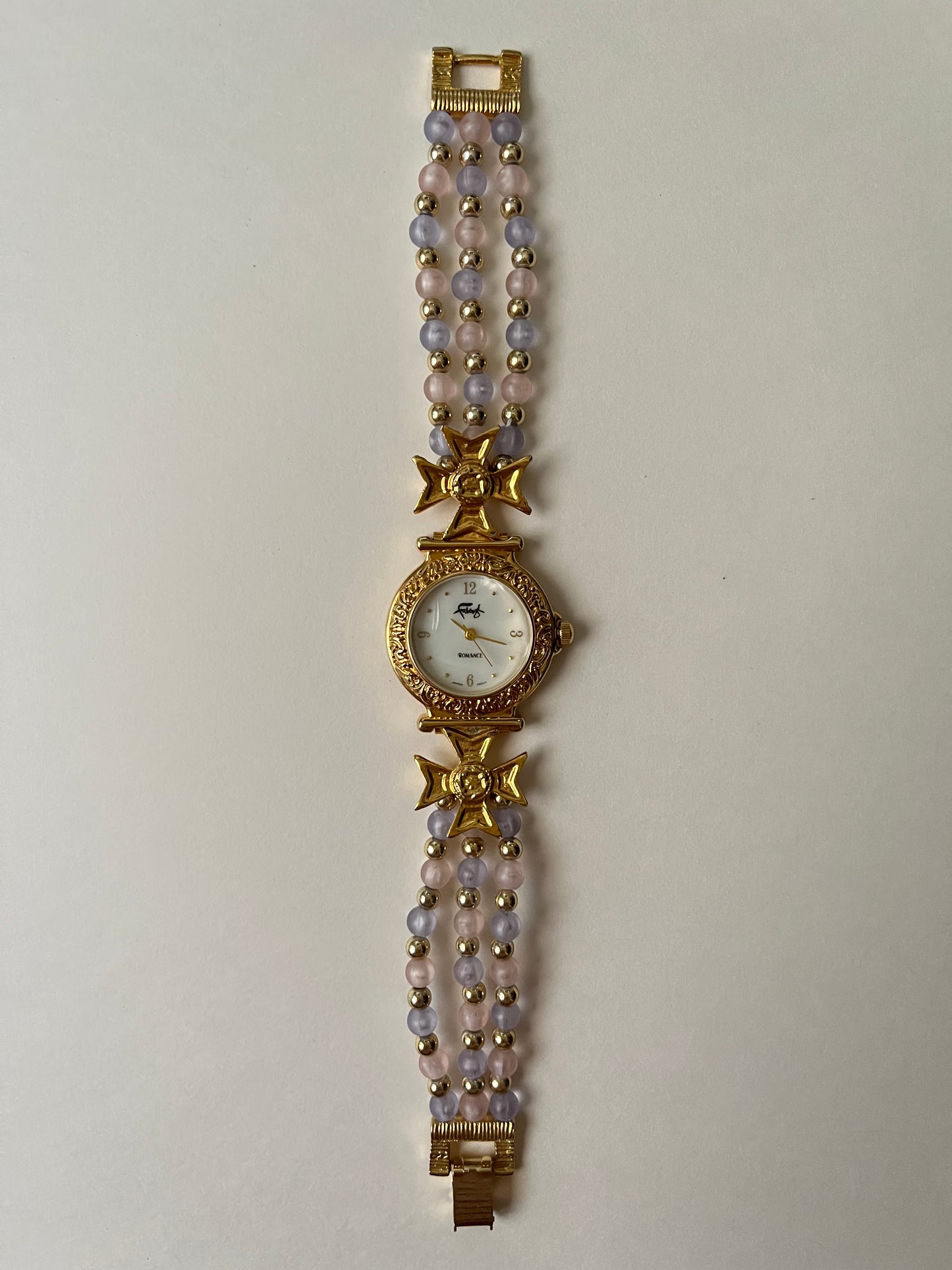 Adorable Gold Tone Watch with Pink and Purple Beaded Band