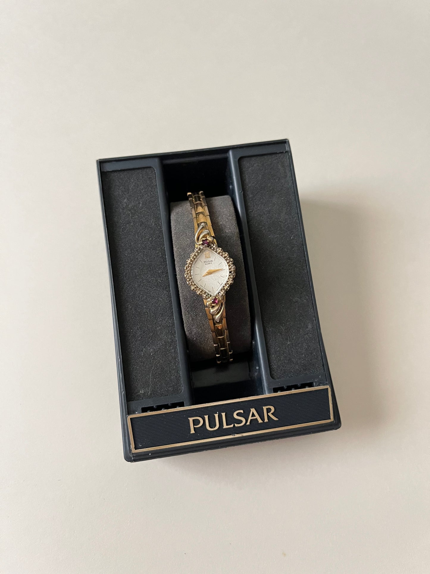 Lovely Gold Tone Pulsar Watch with Rubies Accent and Diamond-Shaped Dial