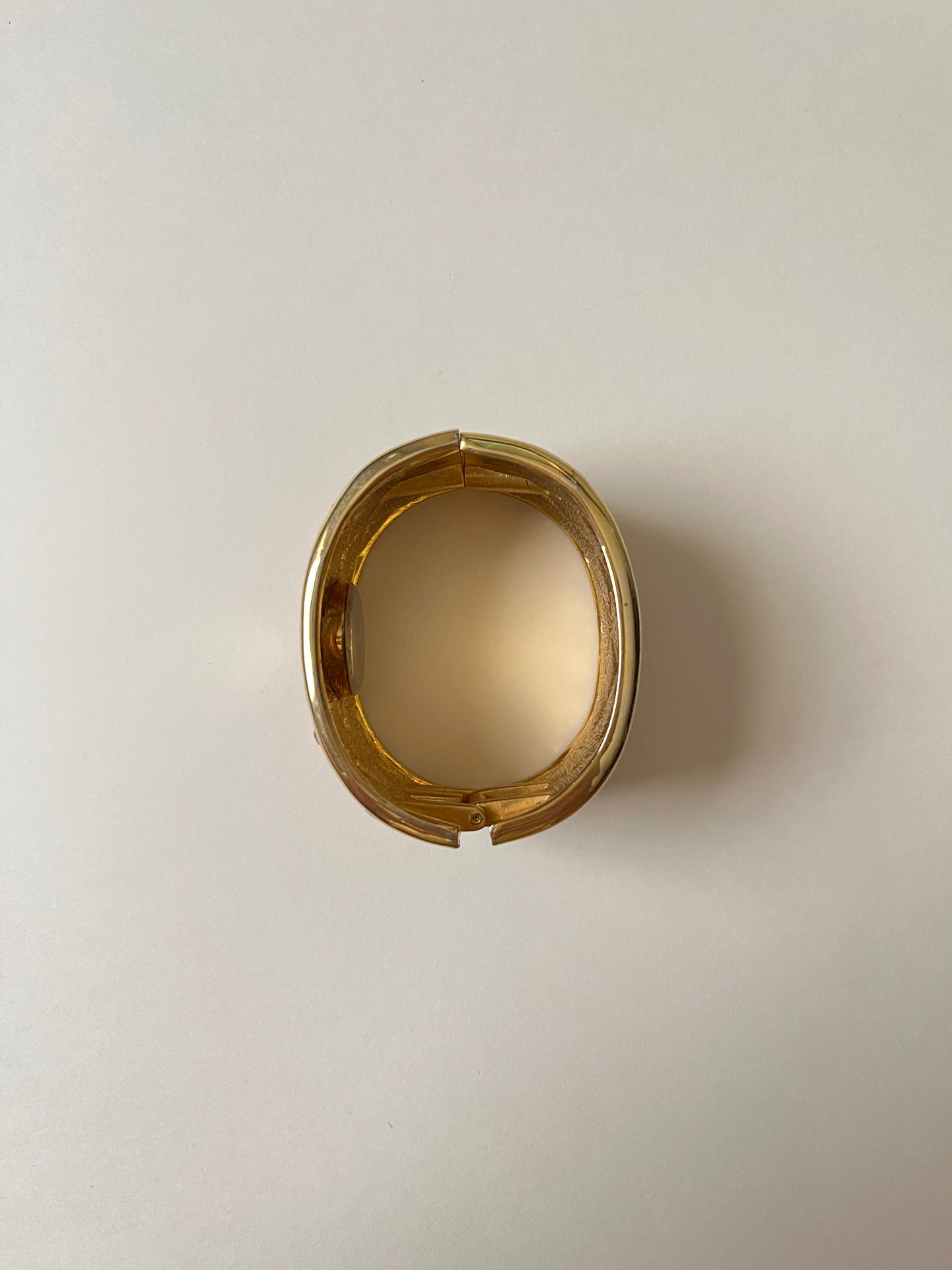 Striking Gold Tone Chunky Cuff Watch with Red and Black Checkerboard Design