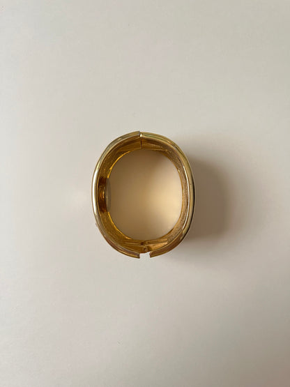 Striking Gold Tone Chunky Cuff Watch with Red and Black Checkerboard Design