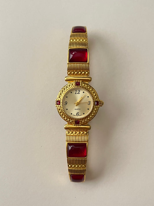 Gorgeous Gold Tone Expansion Watch with Red Gems Accent