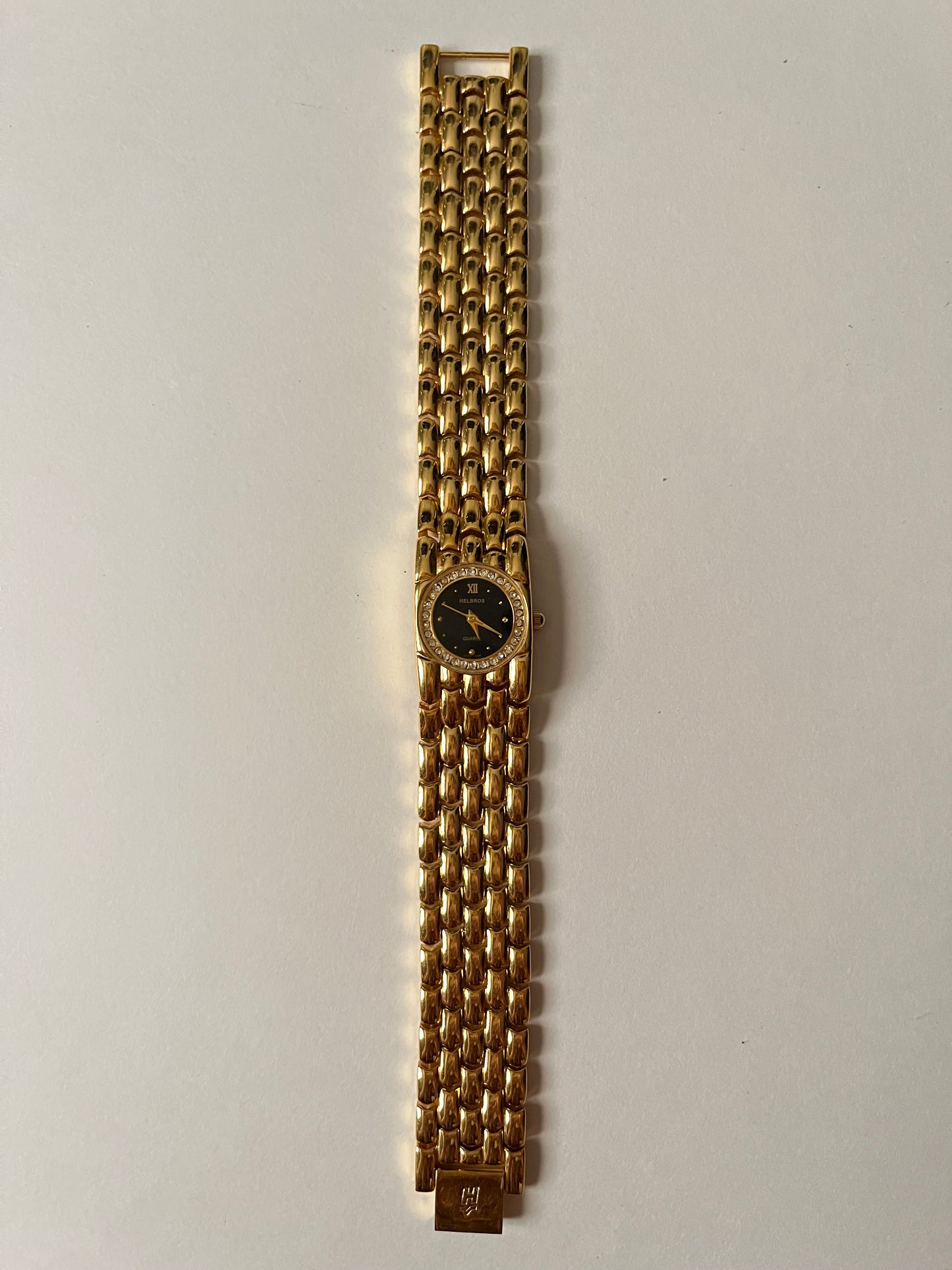 Very Chic Gold Tone Watch with Black Round Dial and Rhinestones Accent
