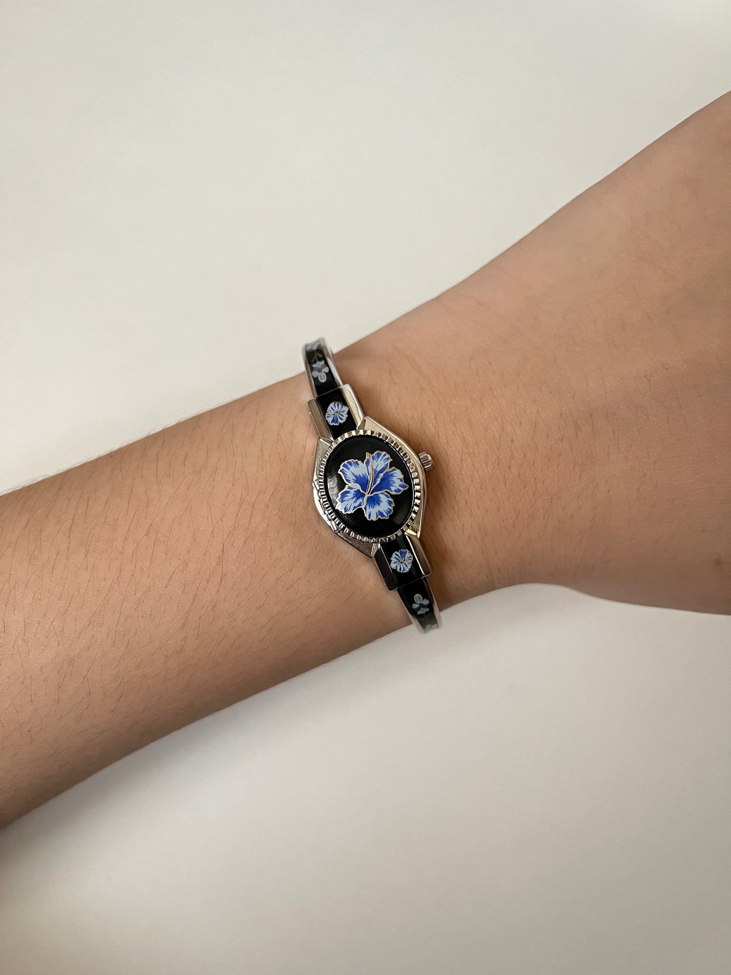 Beautiful Silver Tone Open Cuff Peekaboo Swiss Watch with Black Floral Enameled Bracelet