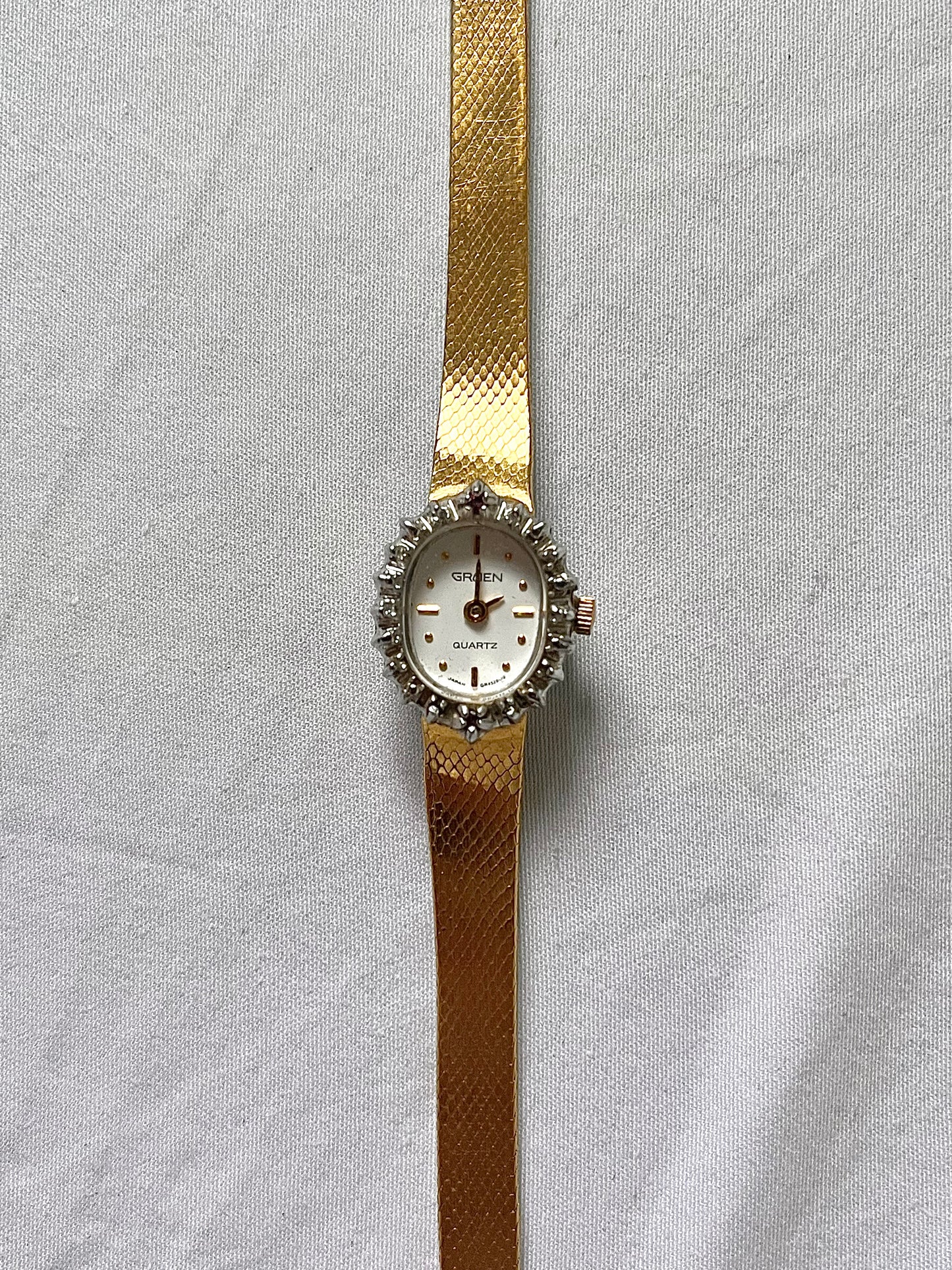 Gold Tone Watch with Diamonds and Rubies on Bezel