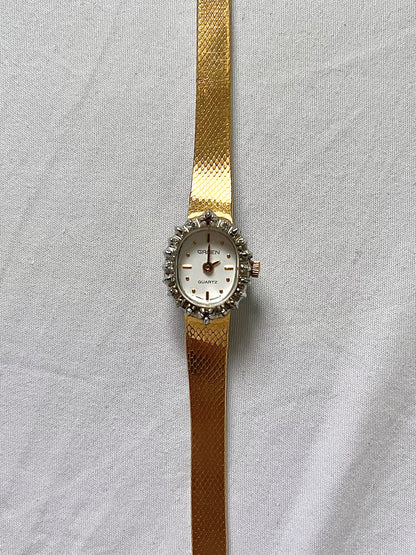 Gold Tone Watch with Diamonds and Rubies on Bezel