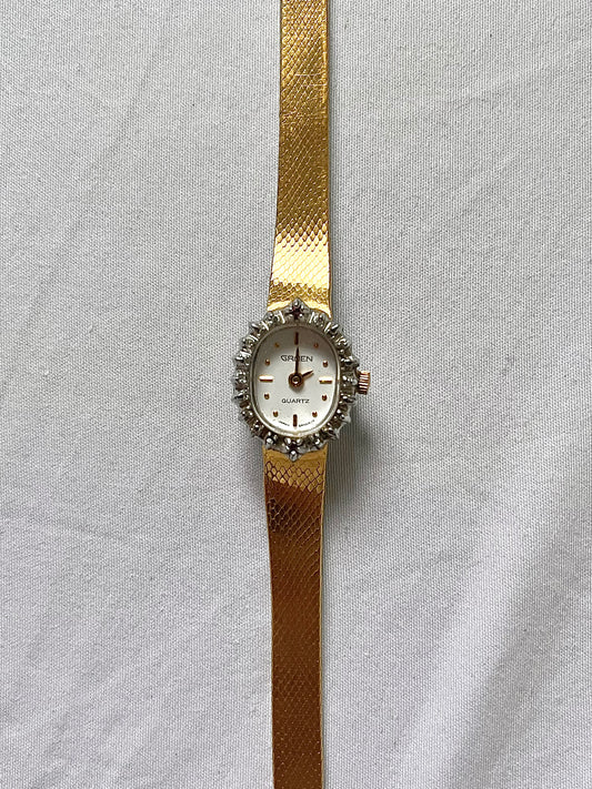 Gold Tone Watch with Diamonds and Rubies on Bezel