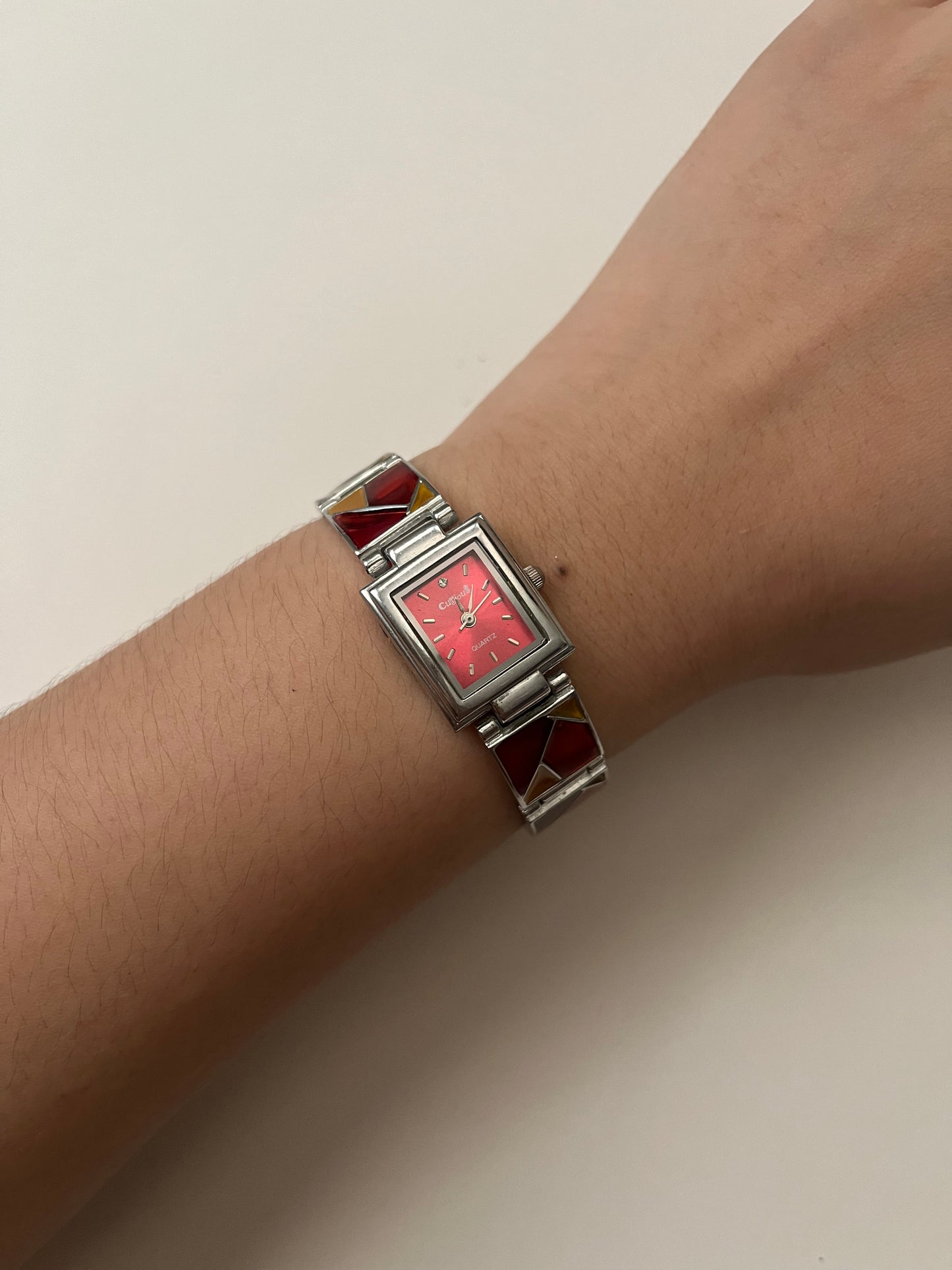 Silver Tone Watch with Red Dial and Mosaic Tiles Band Design