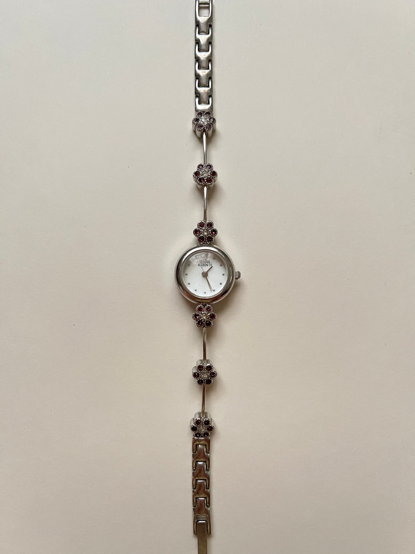 Cute and Dainty Silver Tone Anne Klein Watch with Purple Flower Rhinestones Accent